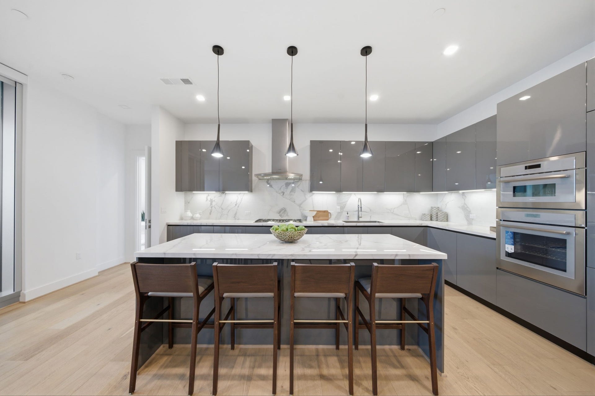 Sophisticated design meets everyday functionality in this expansive open concept kitchen.