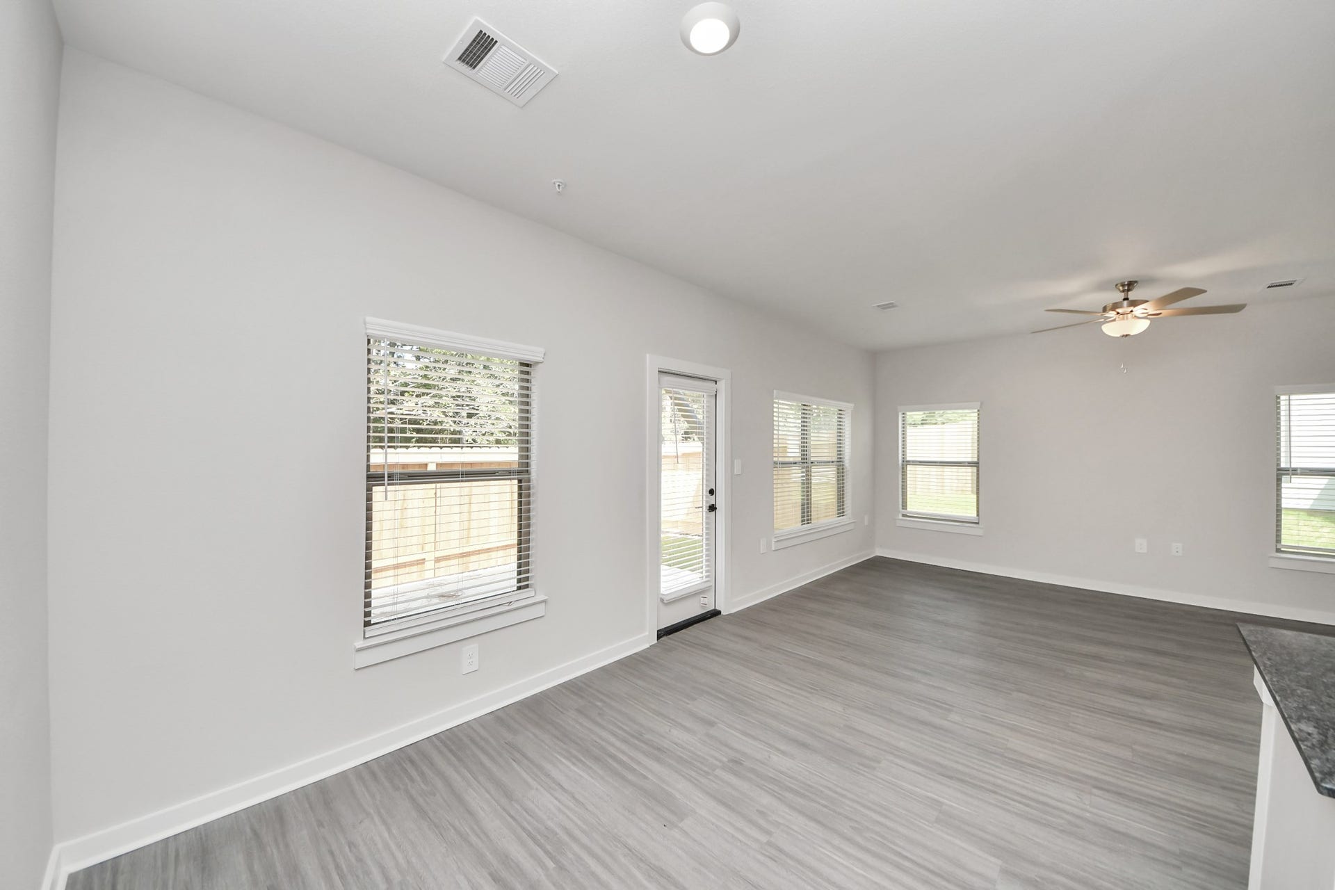 7711 Longmire Road, #199, Conroe, TX 77304 Boasting luxury finishes-stylish Island kitchen,granite counters,subway tile backsplash,ample custom cabinet space,stainless appliances,refrigerator,full size washer&dryer included,wood-like floors throughout,open concept floor plan.