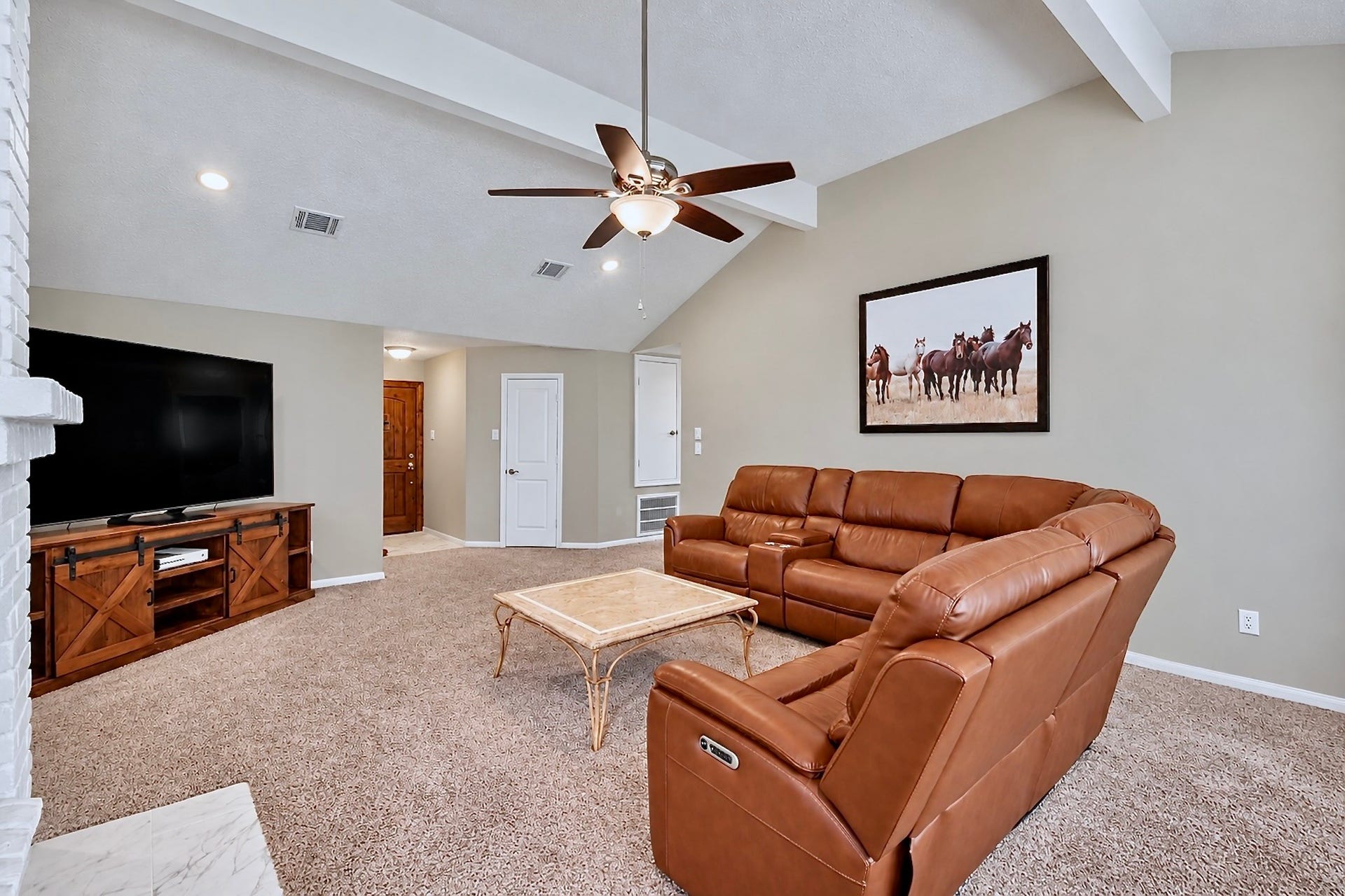 2419 Broken Elm Drive, Richmond, TX 77406 Made for real lifethe expansive living room offers room for conversation, media, fireplace evenings and a crowd when everyone somehow ends up at your house.