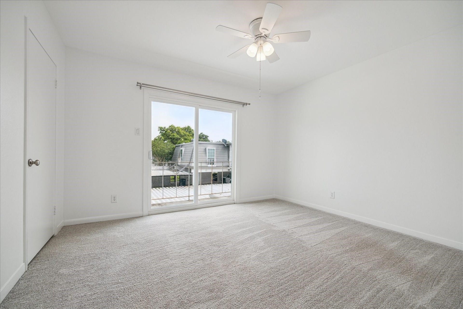 7821 Rue Saint Cyr Street, #55, Houston, TX 77074 Generously sized secondary bedroom with balcony access.