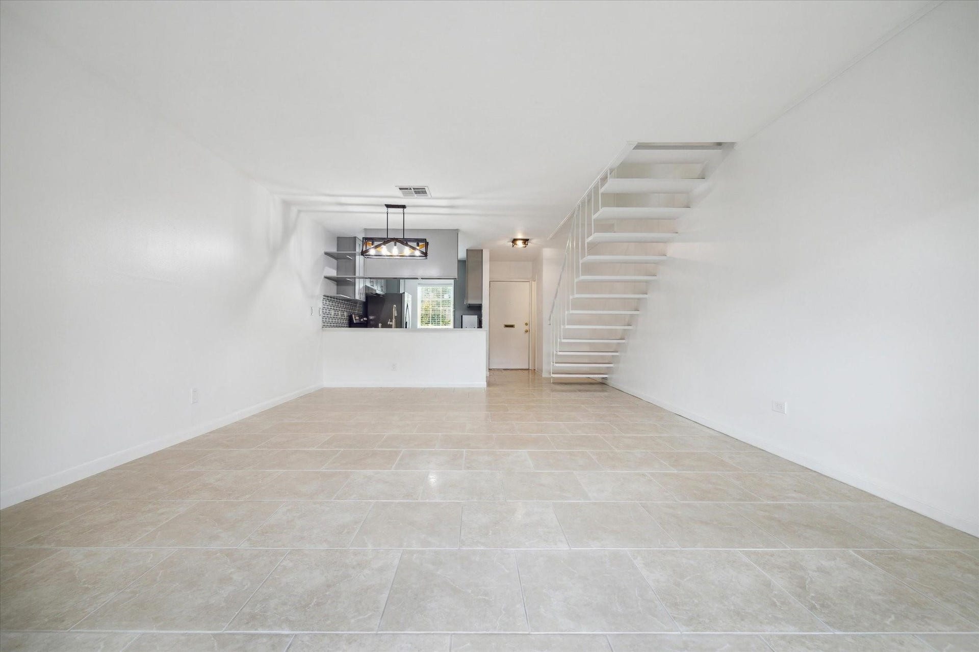 7821 Rue Saint Cyr Street, #55, Houston, TX 77074 Spacious open-concept living and dining area.