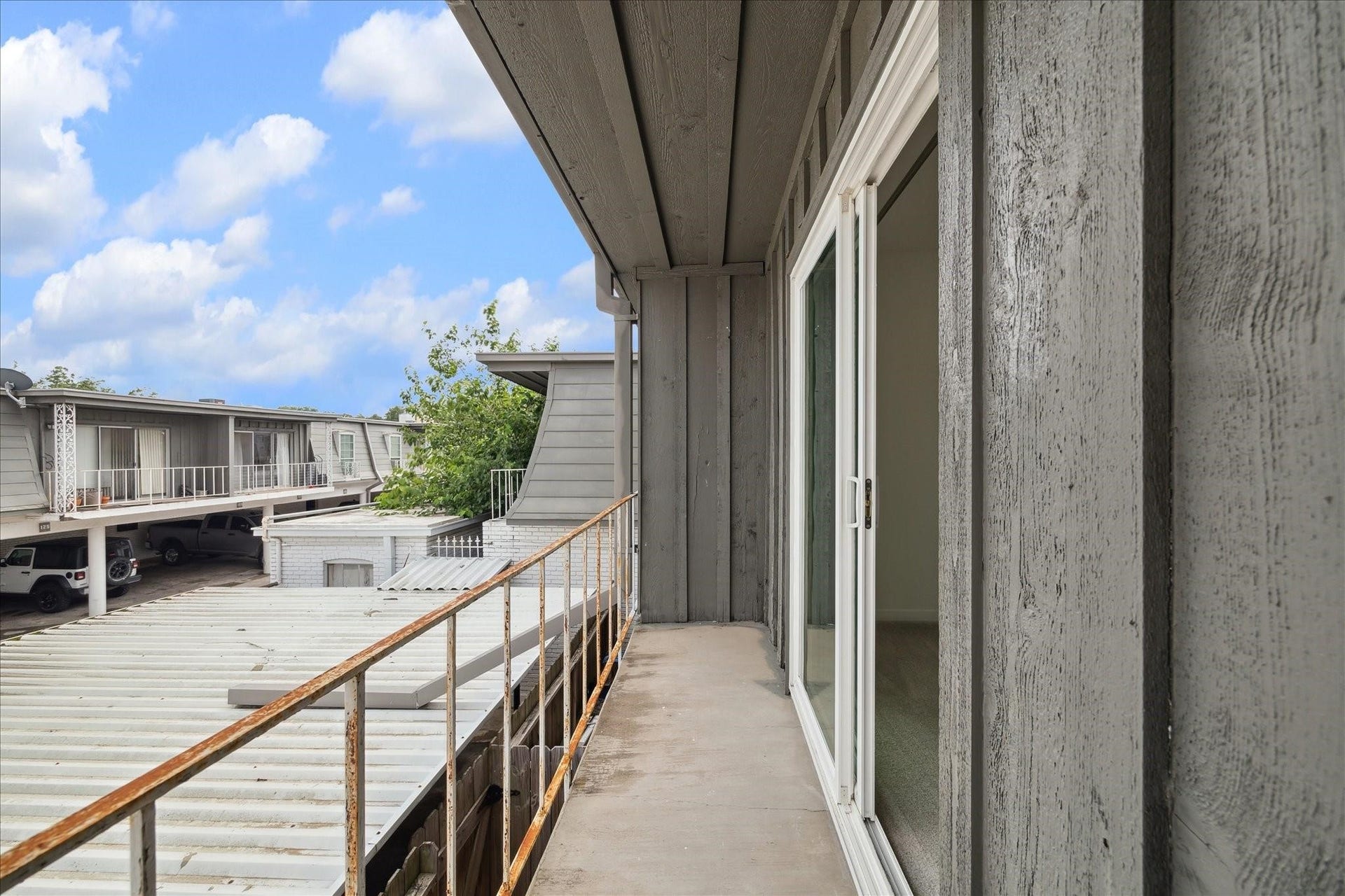 7821 Rue Saint Cyr Street, #55, Houston, TX 77074 Private second-floor balcony overlooking the courtyard.