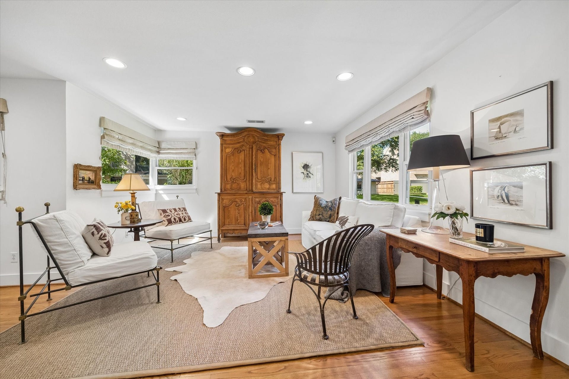 Roman shades elevate every window throughout the home.