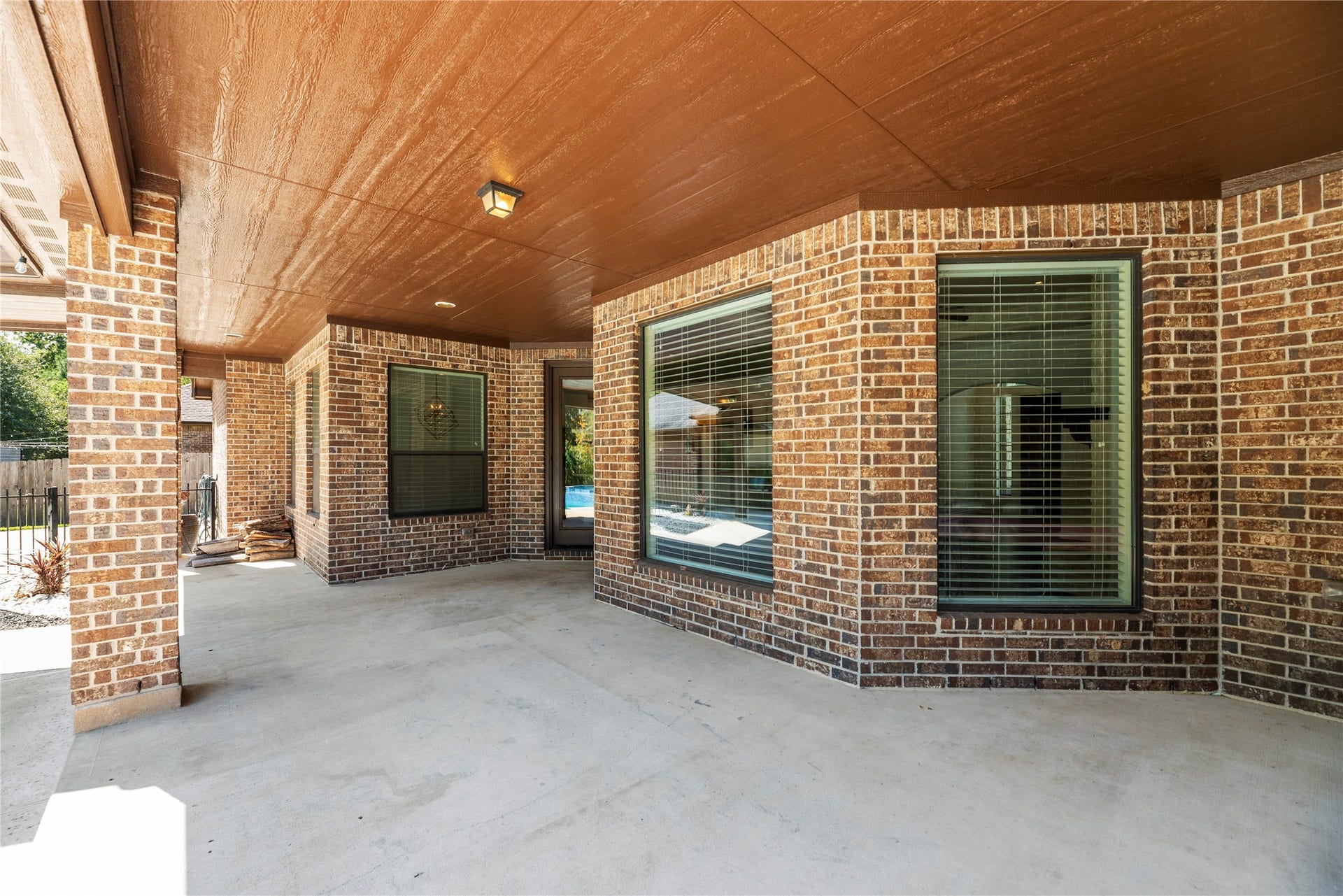 12522 Savage Court, Magnolia, TX 77354 Extended covered patio has plenty of room to create a beautiful outdoor seating and dining area overlooking the backyard.
