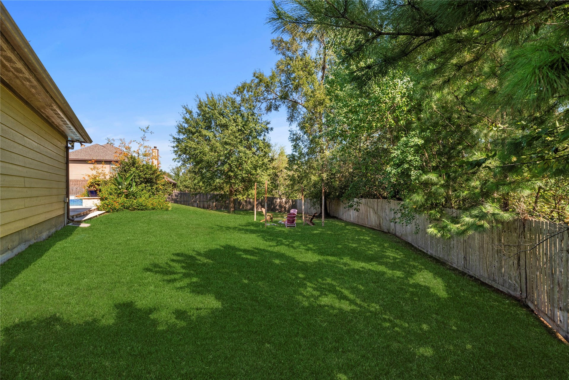 12522 Savage Court, Magnolia, TX 77354 Plenty of green space behind the pool.