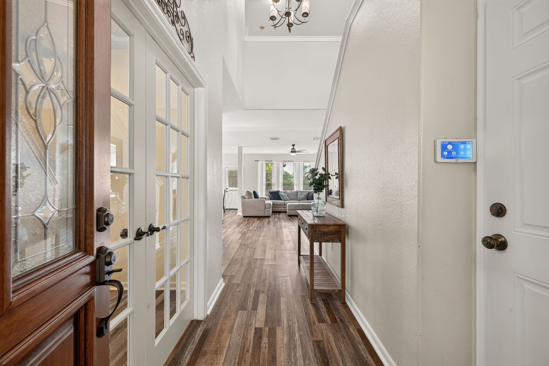 17307 Thicket Hollow Lane, Cypress, TX 77429 This inviting entryway features a glass-paneled front door and French doors leading to a study.