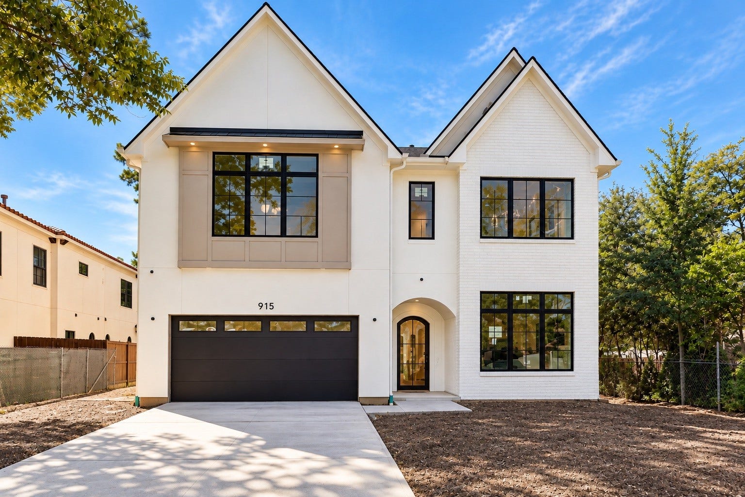 915 Lamonte Lane, Houston, TX 77018 White painted brick will unify the exterior, highlighting steep gables, black framed windows and a welcoming arched entry. Digitally enhanced image illustrates the future finish; the existing brick is currently unpainted and will be painted white.