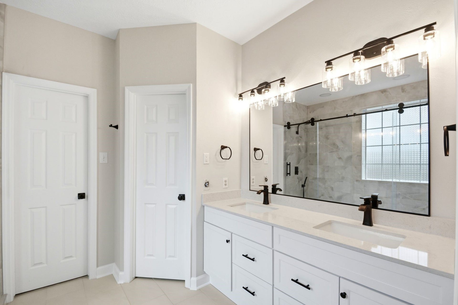 62 S Hidden View Circle, The Woodlands, TX 77381 Doors to walk-in closet (L) and water closet (R)