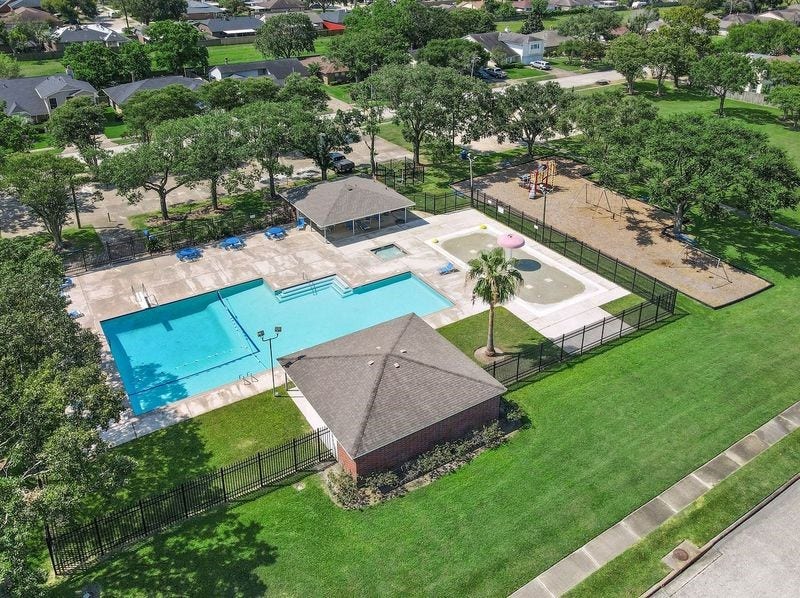 3802 Oakwilde Circle, La Porte, TX 77571 Enjoy Neighborhood Amenities Just Two Blocks Away, Featuring a Community Swimming Pool, Splash Pad, Playground, and Plenty of Space for Outdoor Fun!