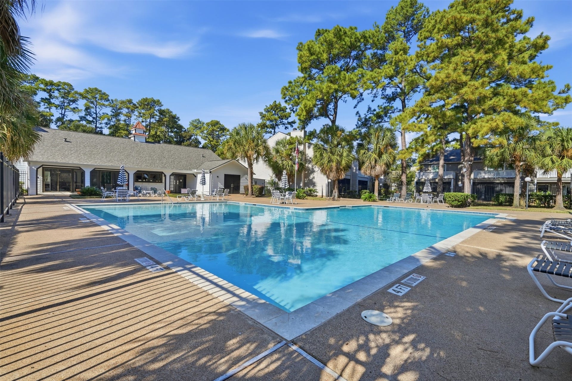 Enjoy the community swimming pool and surrounding lounge area.