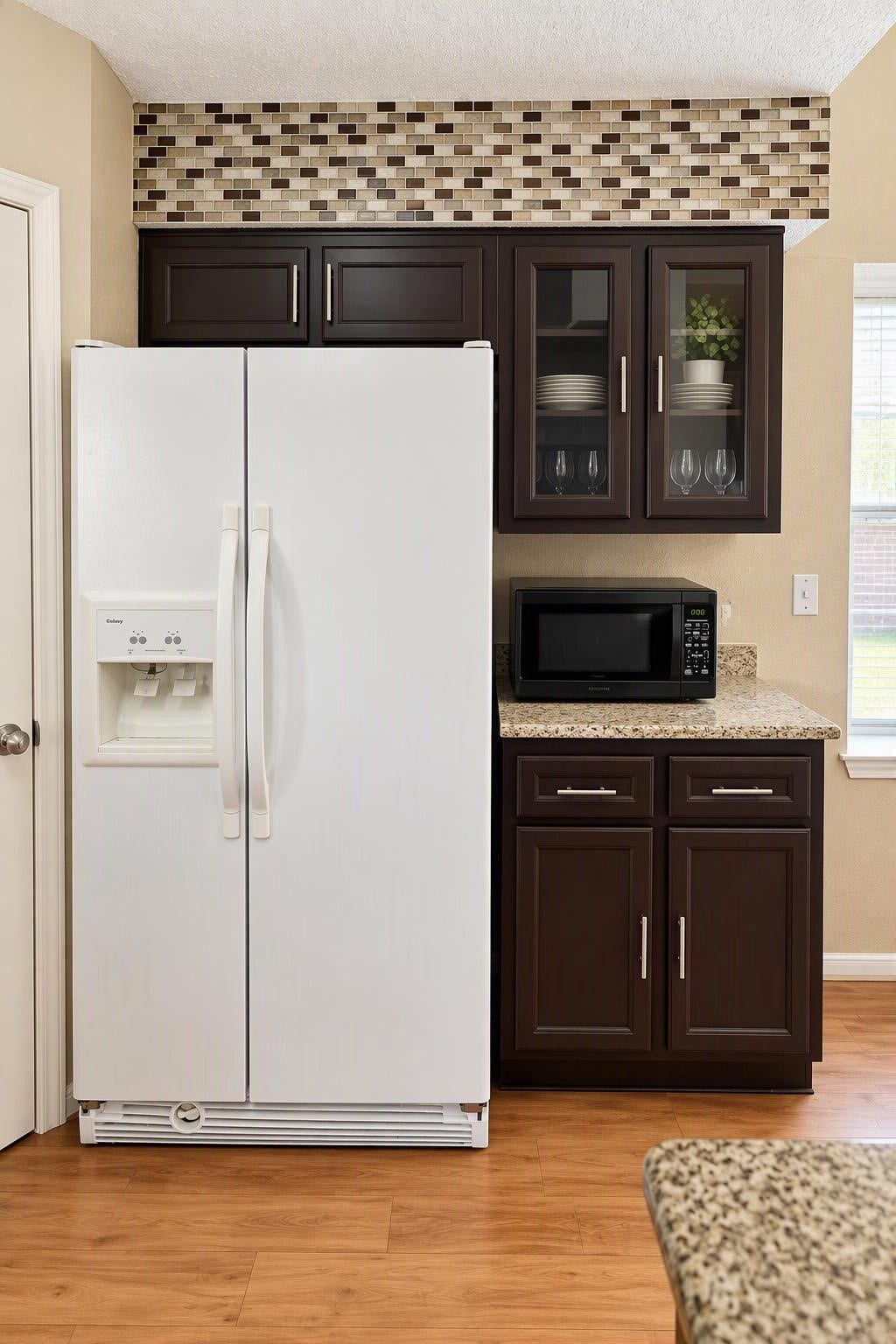 6631 Inwood West Drive, Houston, TX 77088 The "pass through kitchen, is an ene=tertainers dream. Ample serving space, Granite counter-tops refrigerator and microwave included