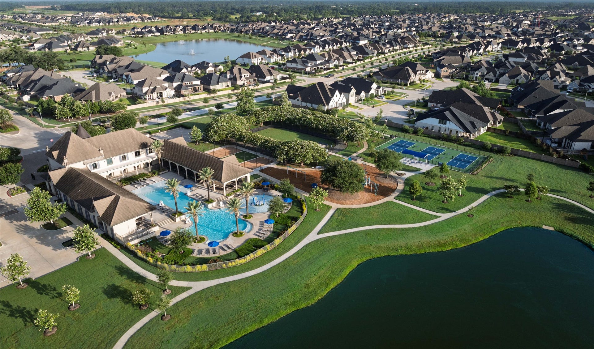 19819 Epona Creek Drive, Tomball, TX 77377 The community pool at Amira, often referred to as The Resort at Amira, is a centerpiece amenity designed to resemble a high-end vacation destination.