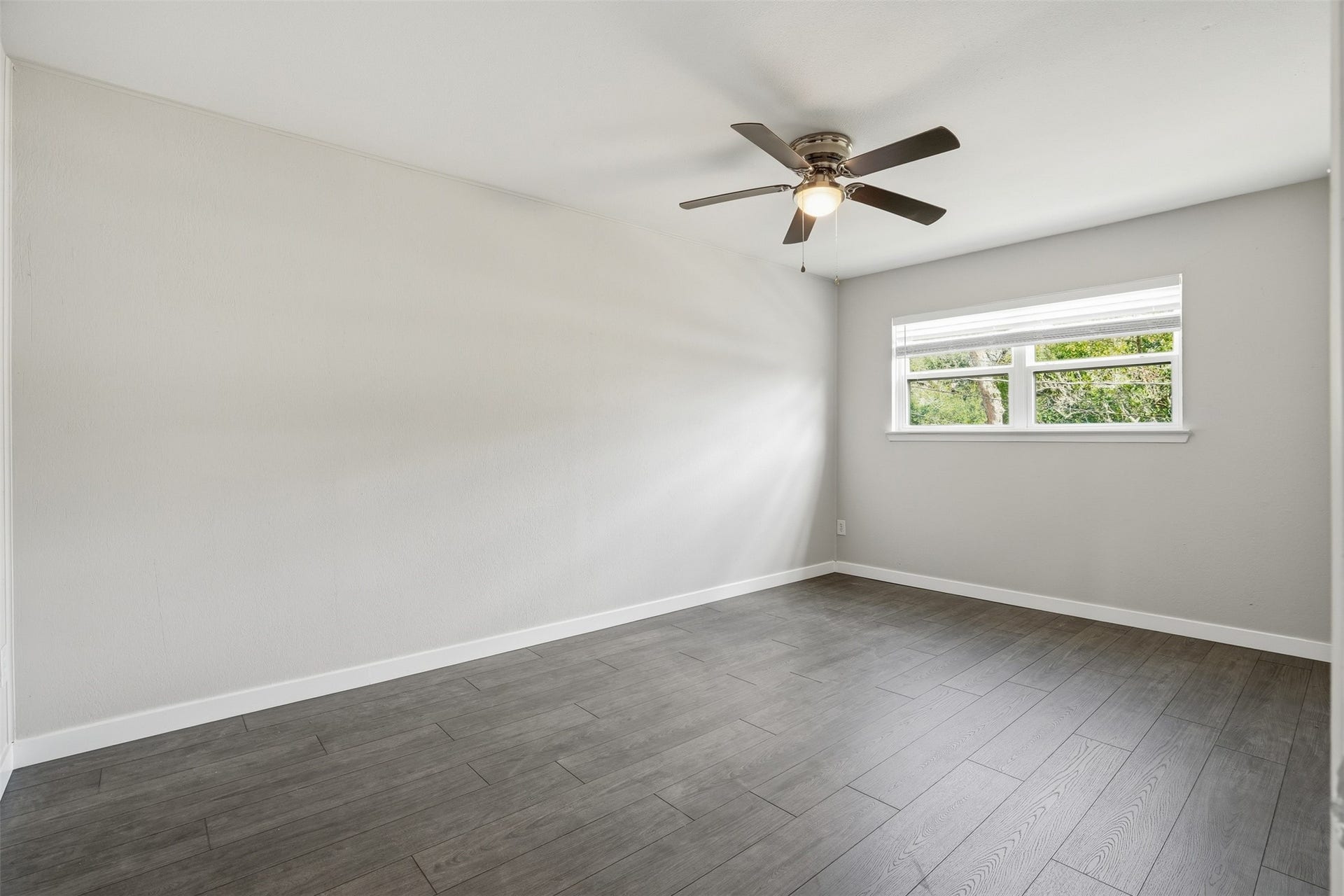 Cozy primary suite offering privacy and a peaceful retreat.
