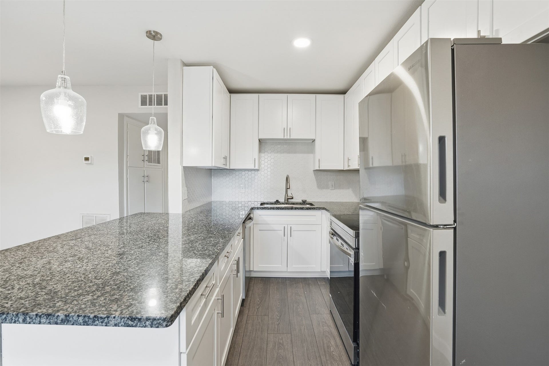 Practical kitchen designed for everyday cooking needs. Photos are of similar unit with identical floor plan.
