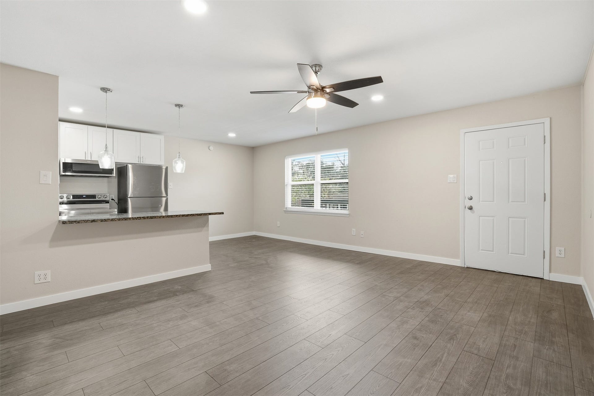Living room featuring a simple, practical design with flexible furnishing options.