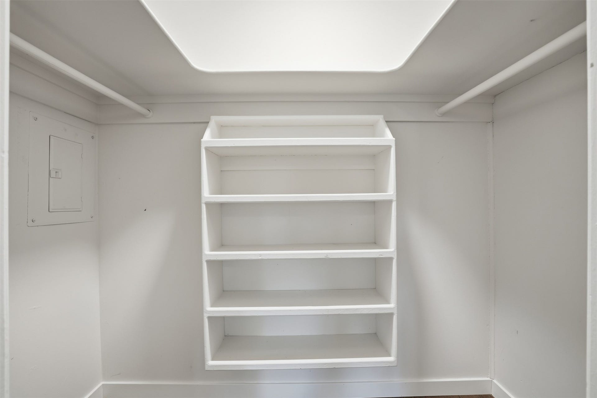 Spacious closet featuring built-in storage solutions for clothing and accessories.