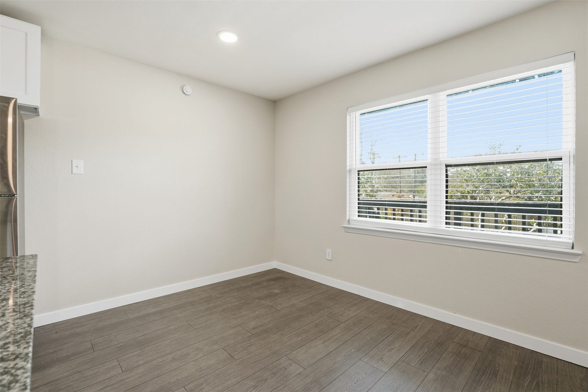 Dining space with natural light and an open layout connecting to the main living area.