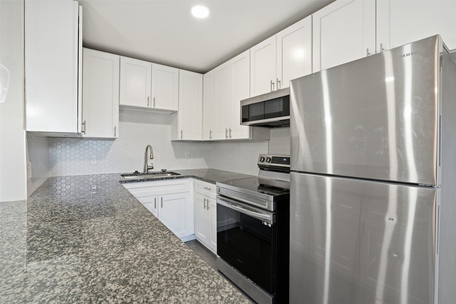kitchen offering functional counter space and cabinet storage.