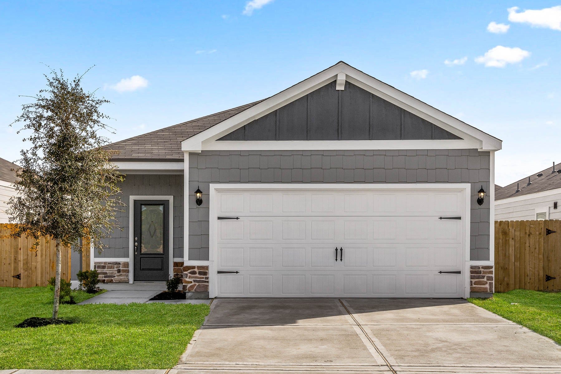6414 Winter Elm Street, Houston, TX 77048 The Dogwood floor plan has beautiful stone detailing on the faade of the home.