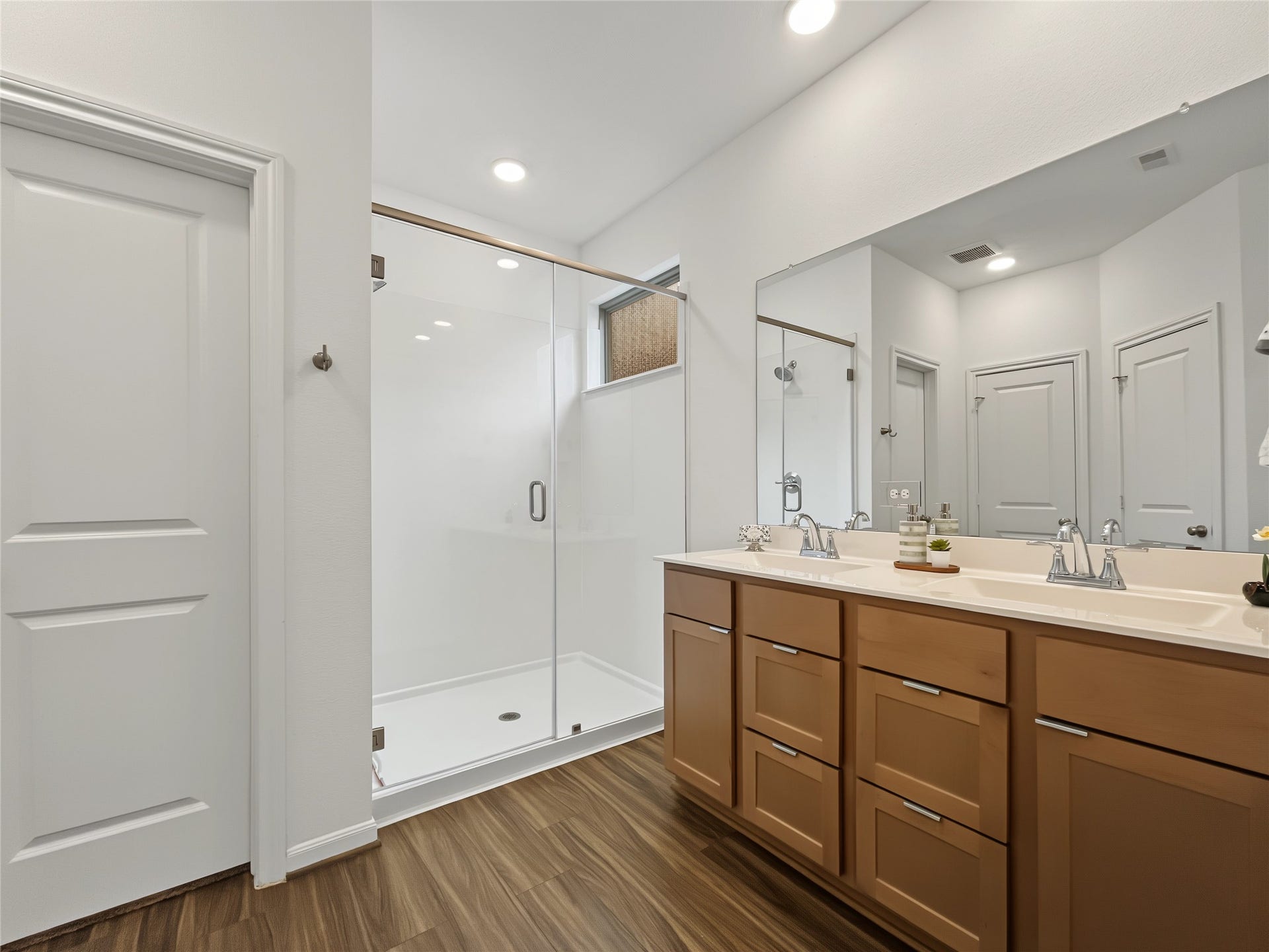 1423 Cecilia Vines Drive, Conroe, TX 77301 View of the shower and the vanity with two sinks in the primary bathroom.