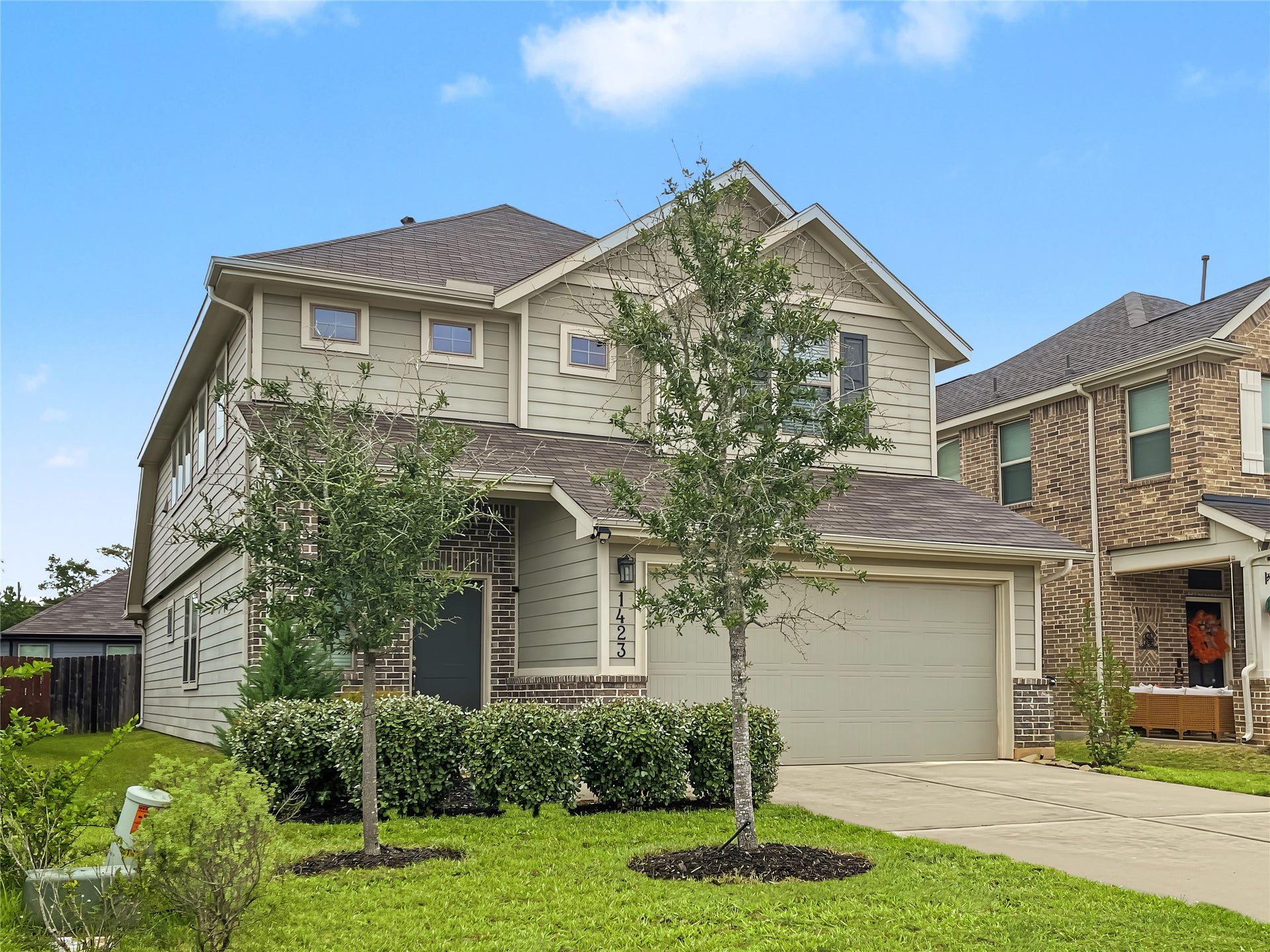 1423 Cecilia Vines Drive, Conroe, TX 77301 View of the front elevation of this beautiful property.