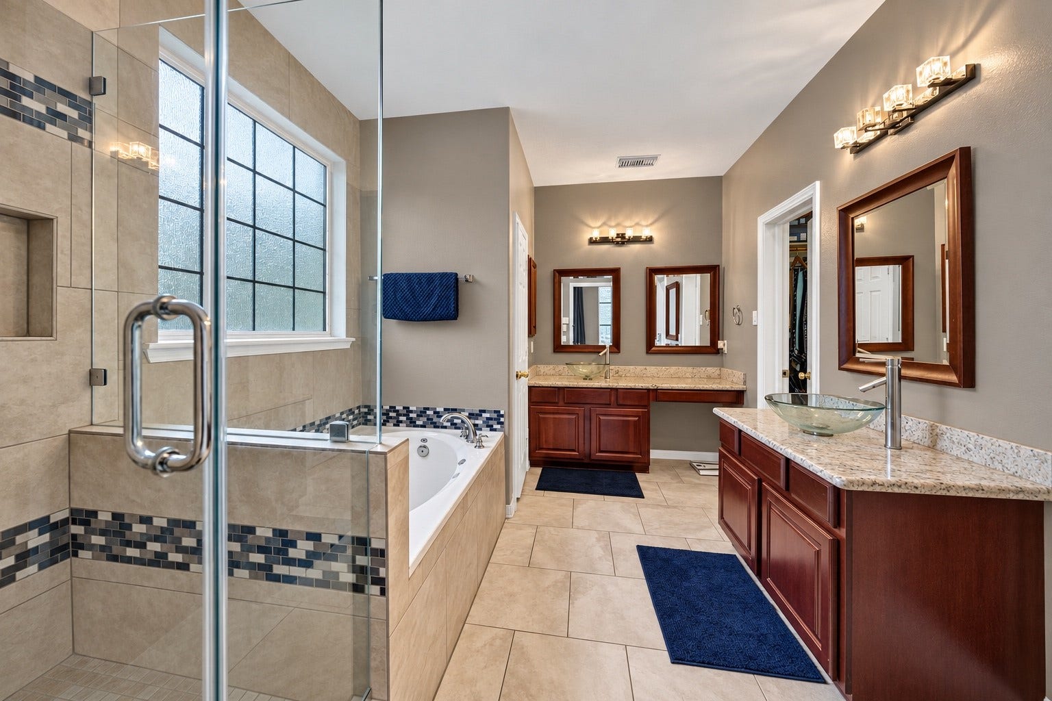 Primary bathroom offering double vanity, separate Tub and shower