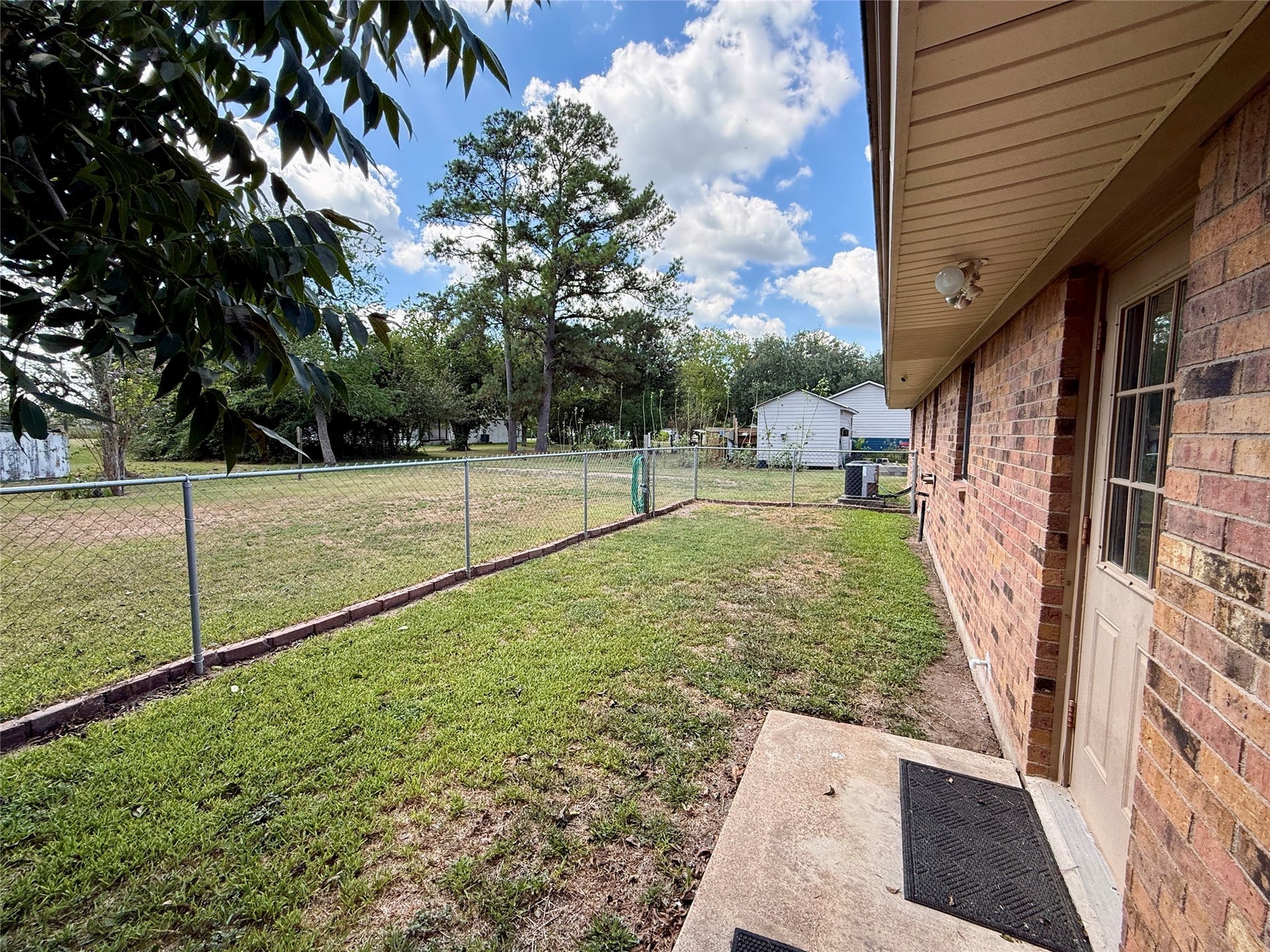 309 Crews Way, West Columbia, TX 77486 Partially fenced back yard