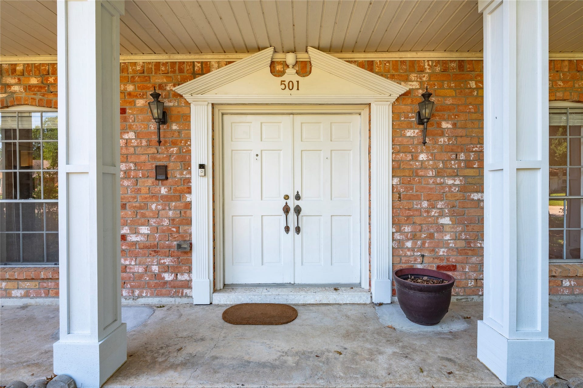 501 Audubon Street, League City, TX 77573 Double wood doors accent the front entryway.