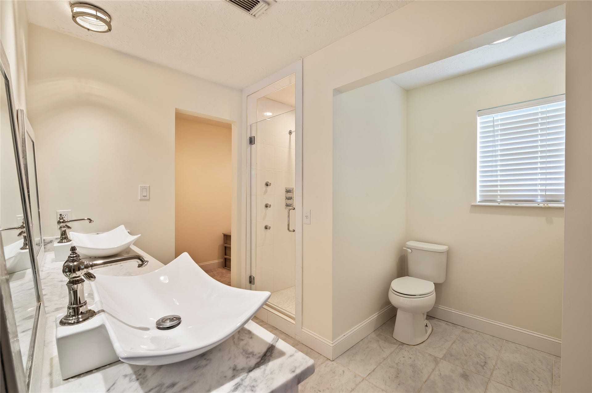501 Audubon Street, League City, TX 77573 Another view of the large primary bath with his/her sinks and additional vanity to the right.
