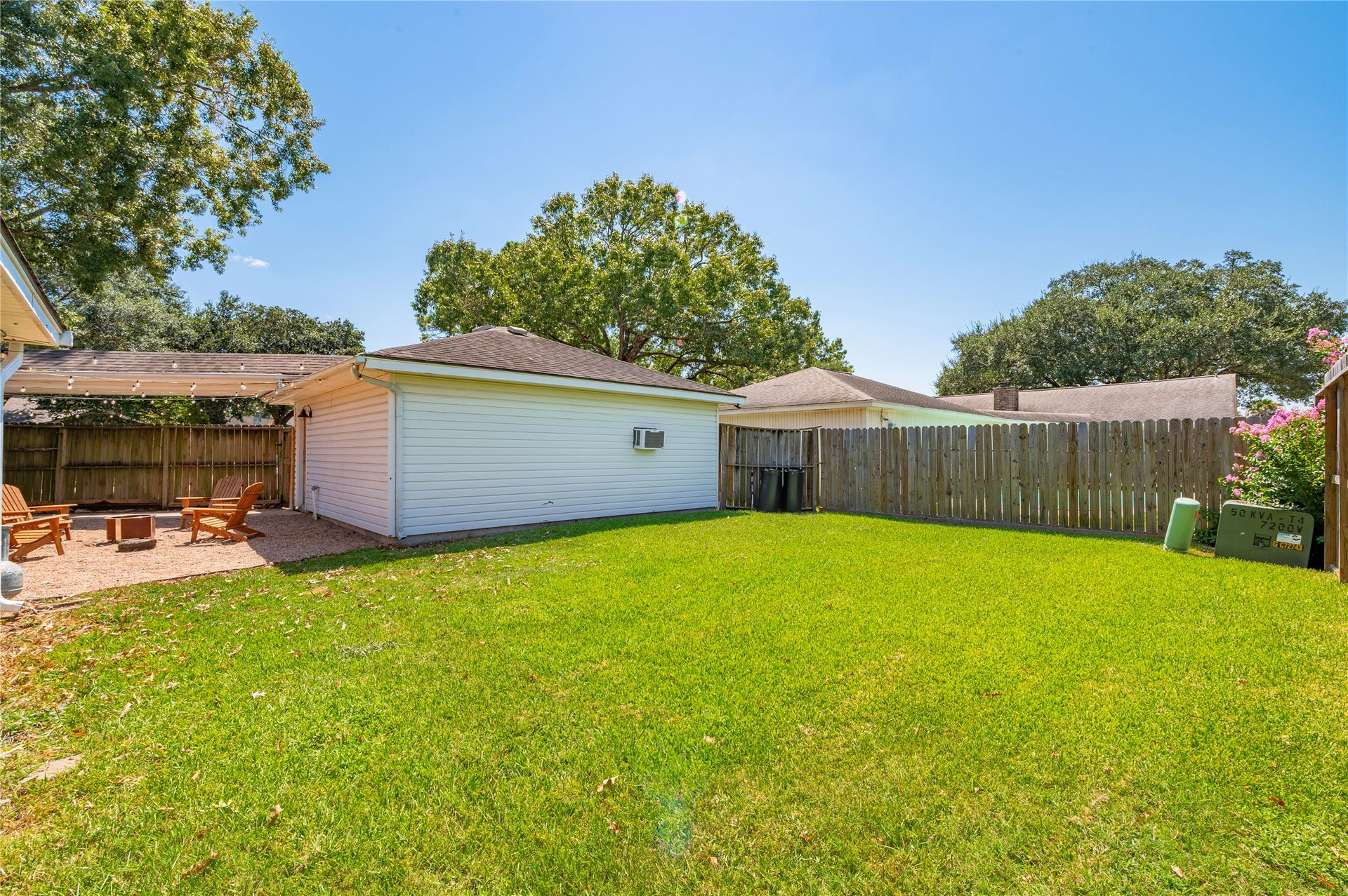 501 Audubon Street, League City, TX 77573 Additional large green backyard space with privacy fencing on all sides.