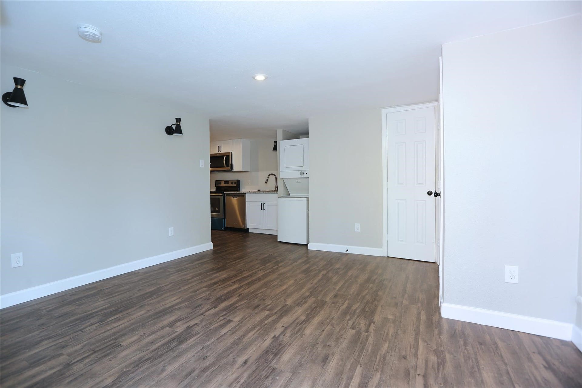 5917 1/2 Sherman Street, #1, Houston, TX 77011 Welcomed by nicely done living room with storage area on the right, kitchen on the left and bathroom straigh ahead.