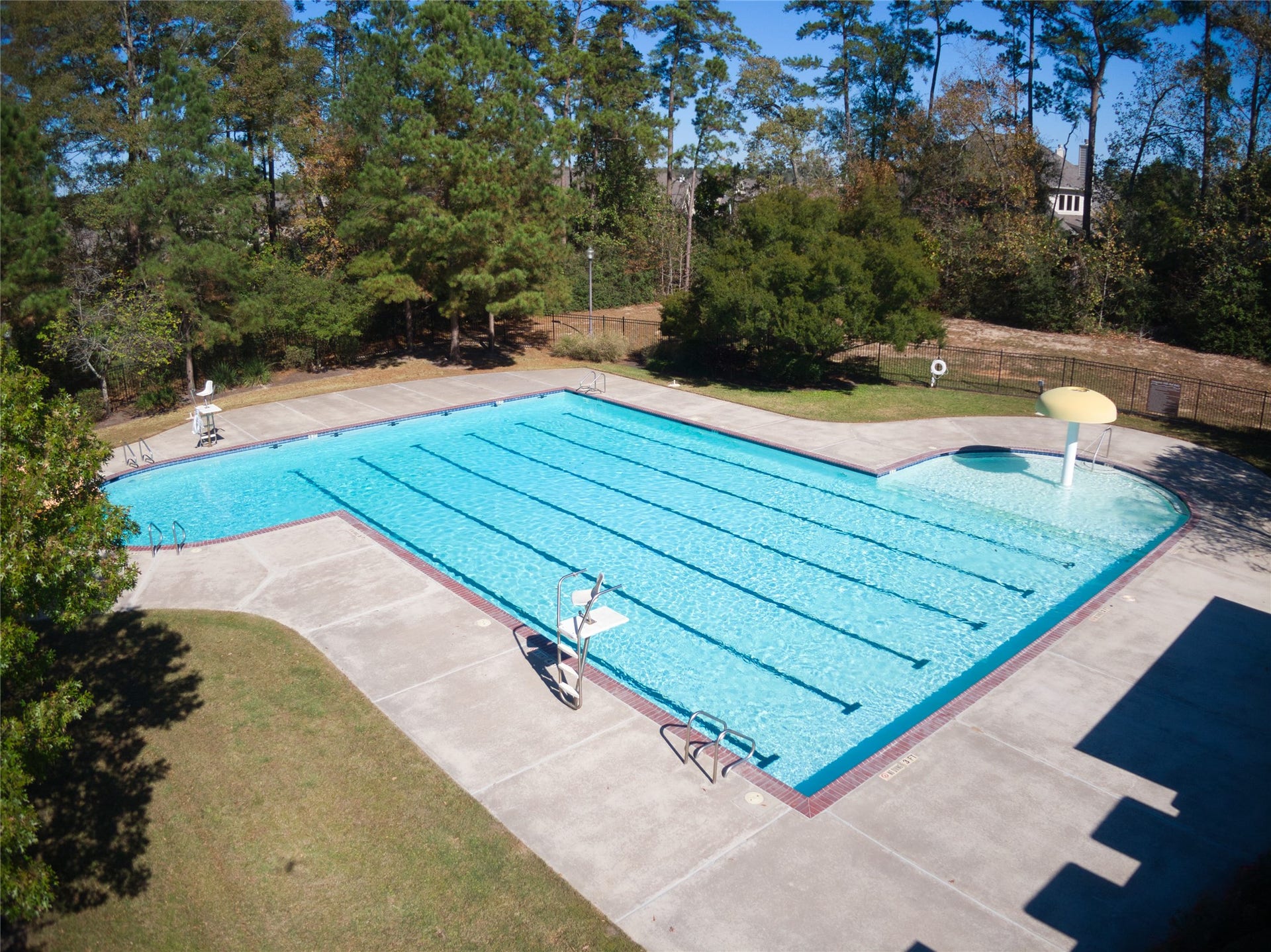 Enjoy the Graystone Hills community swimming pool featuring lap lanes, a shallow splash area and a beautiful wooded backdrop!