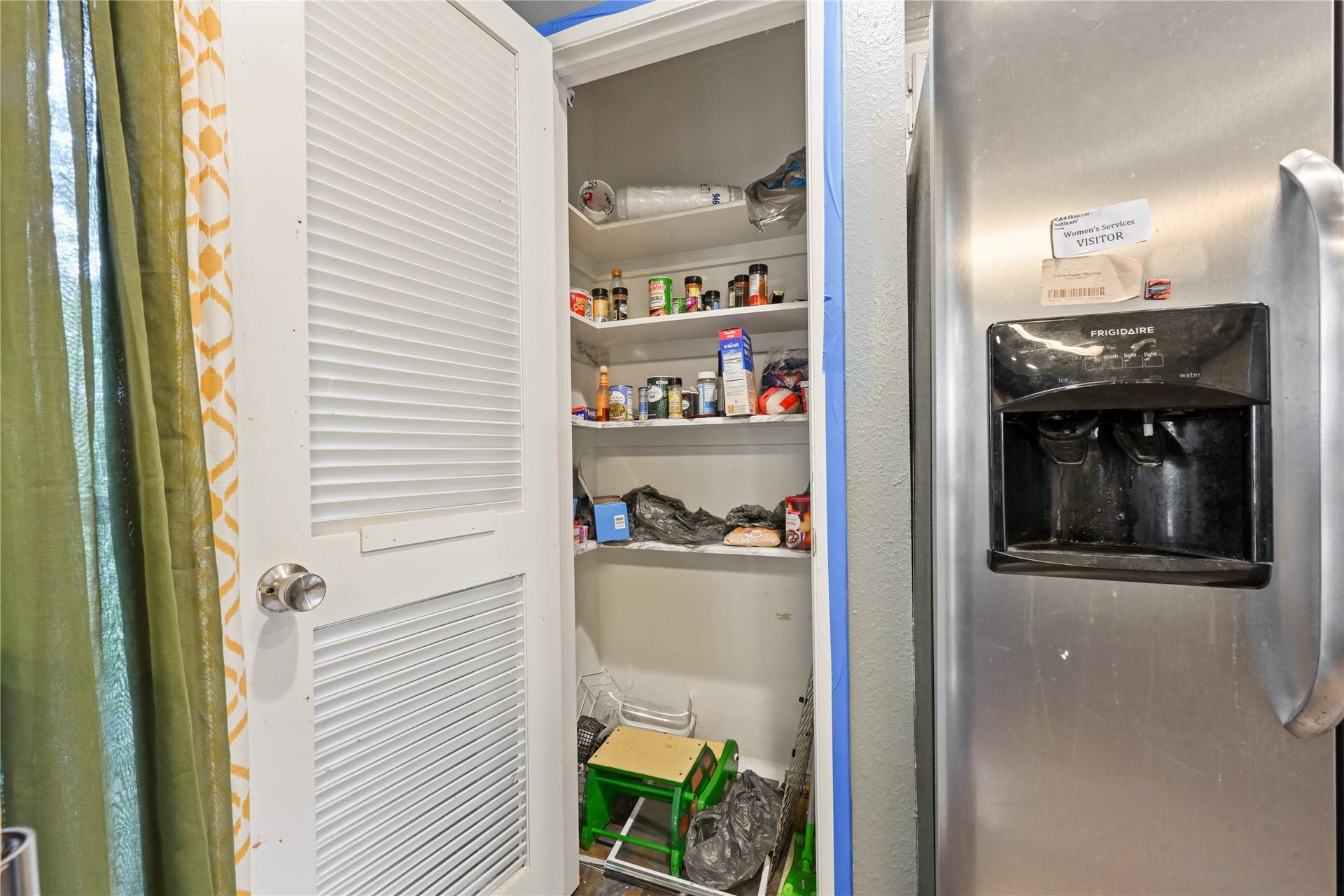 107 Harbour Town Lane, Conroe, TX 77356 Detailed view of the kitchen pantry storage and built-in wall oven setup.