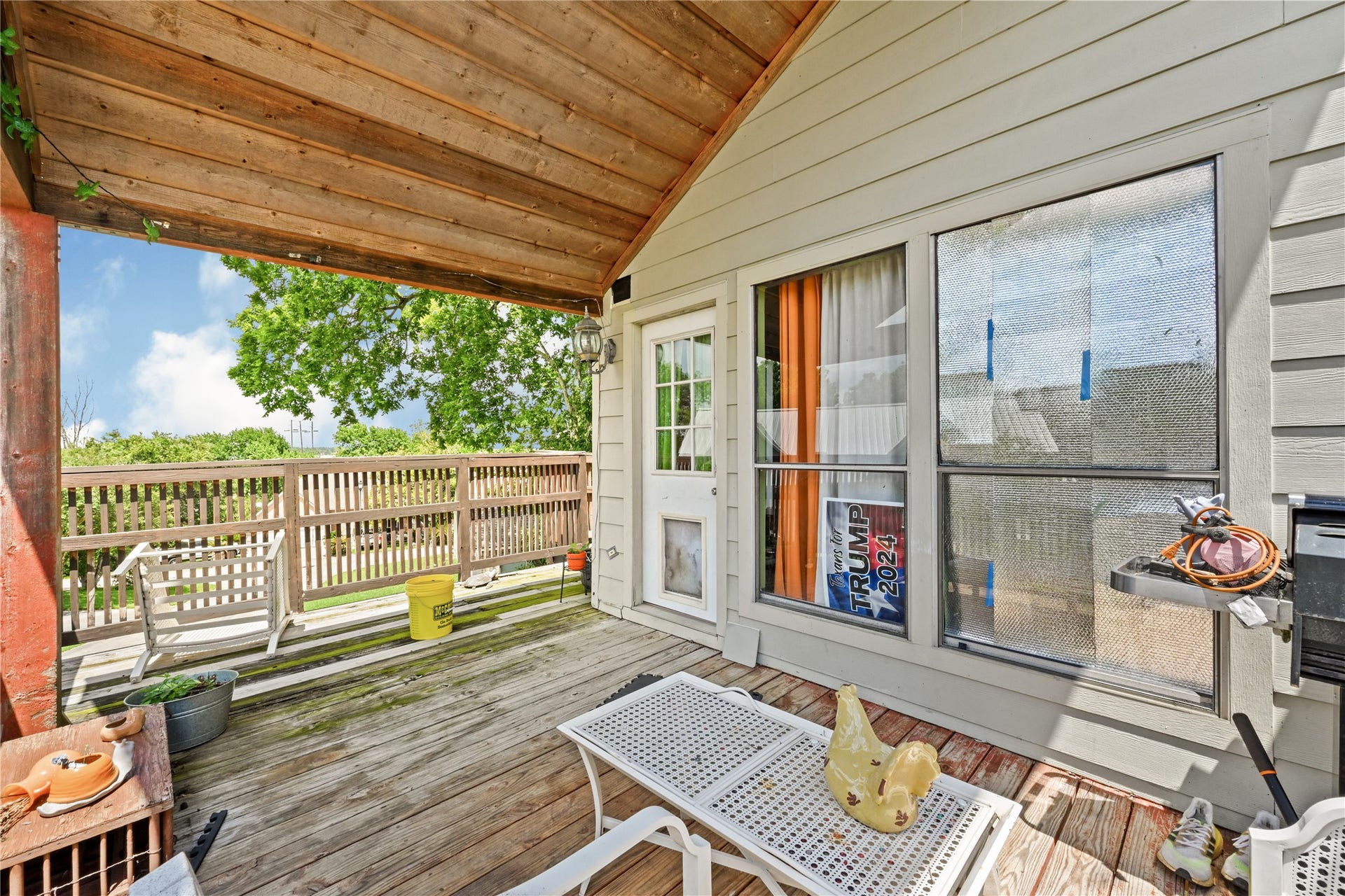 107 Harbour Town Lane, Conroe, TX 77356 Elevated upper-level deck area with a partial wood overhang, providing an excellent footprint for an outdoor seating or dining arrangement.