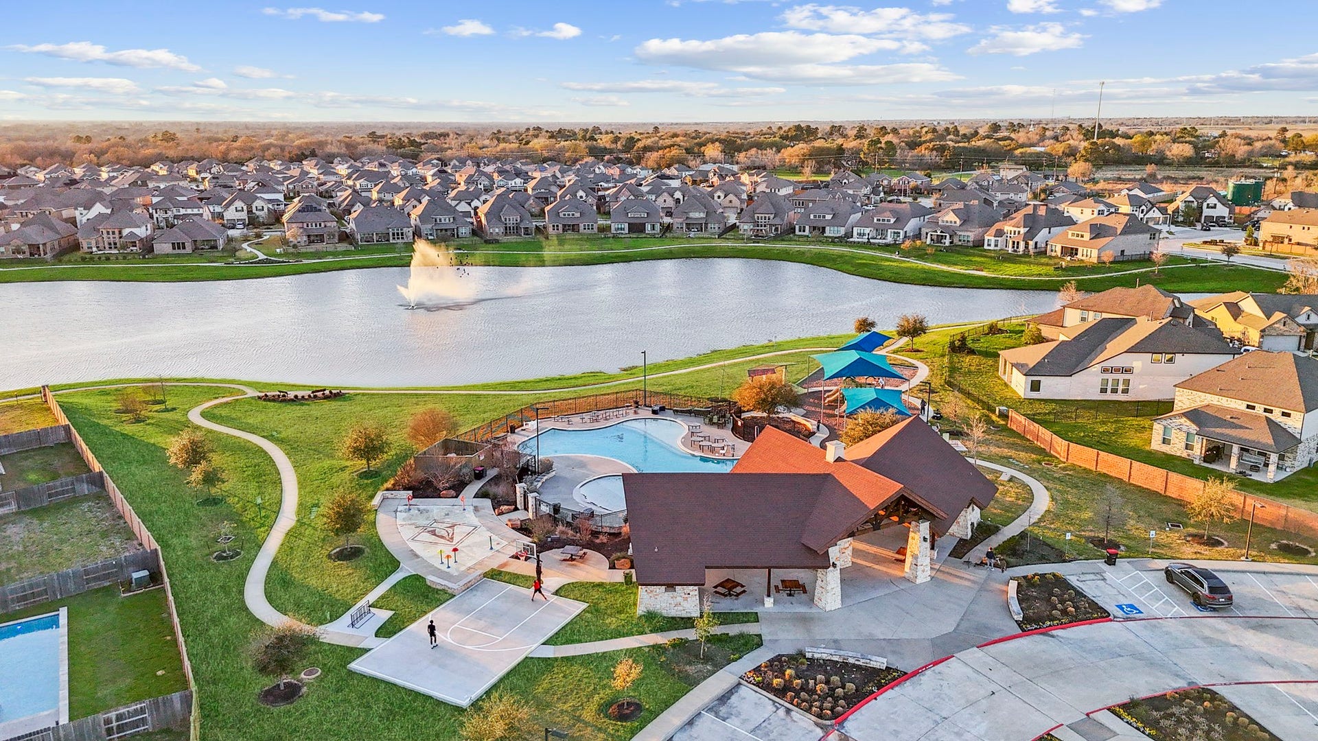 5406 Rustic Ruby Dr, Fulshear, TX 77423 Community Amenities include a Clubhouse, Pavilion with a Fire Pit & a Splash Pad