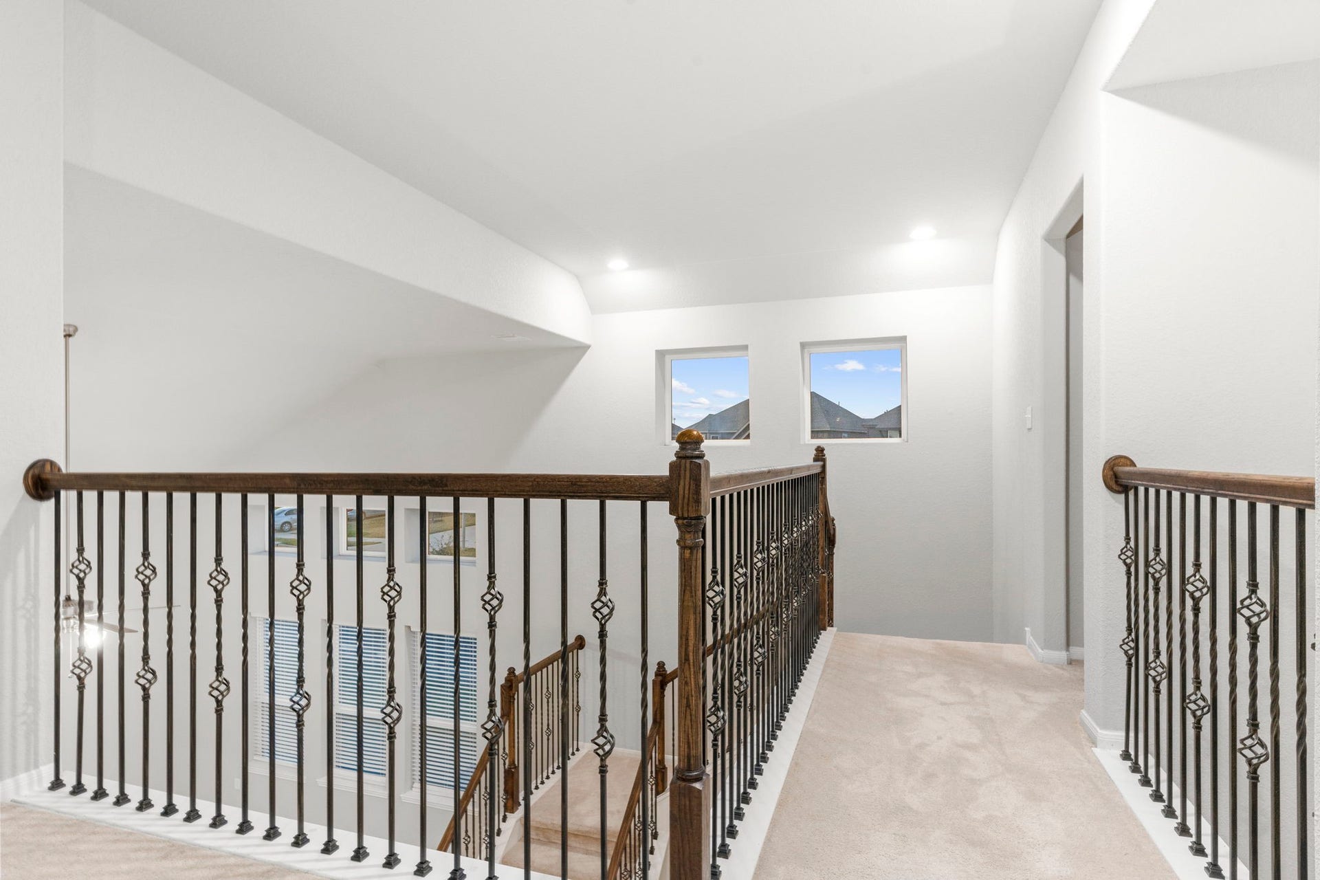 5406 Rustic Ruby Dr, Fulshear, TX 77423 Coming up the elegant staircase onto the Gameroom Upstairs