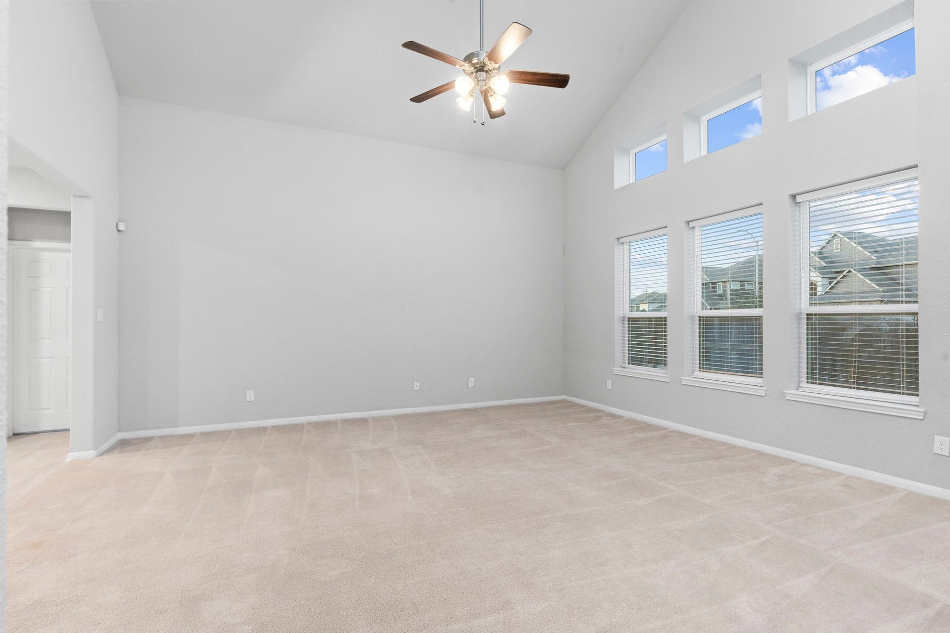 5406 Rustic Ruby Dr, Fulshear, TX 77423 Family Room with wall of windows for ample natural light