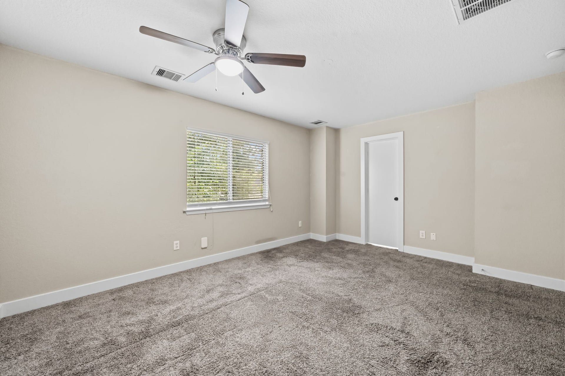 26853 Haileys Manor, Kingwood, TX 77339 Spacious primary bedroom with door to the ensuite bathroom