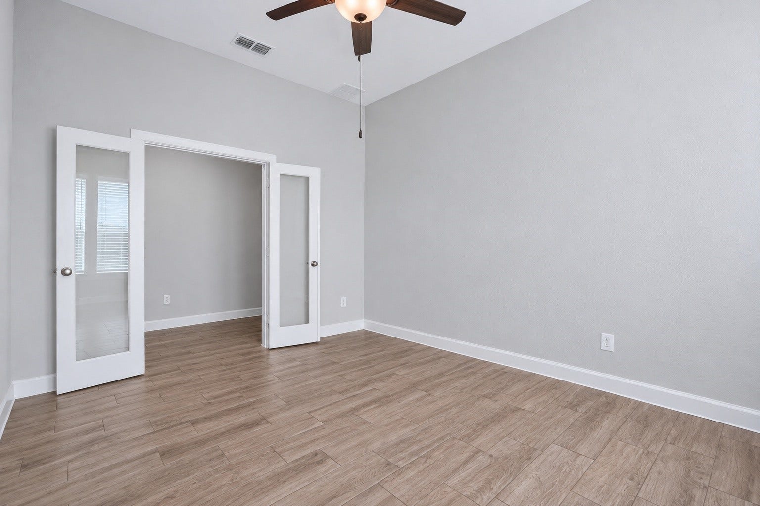 1515 Shining Willow Court, Richmond, TX 77406 Private home office with French doors, perfect for work or study.