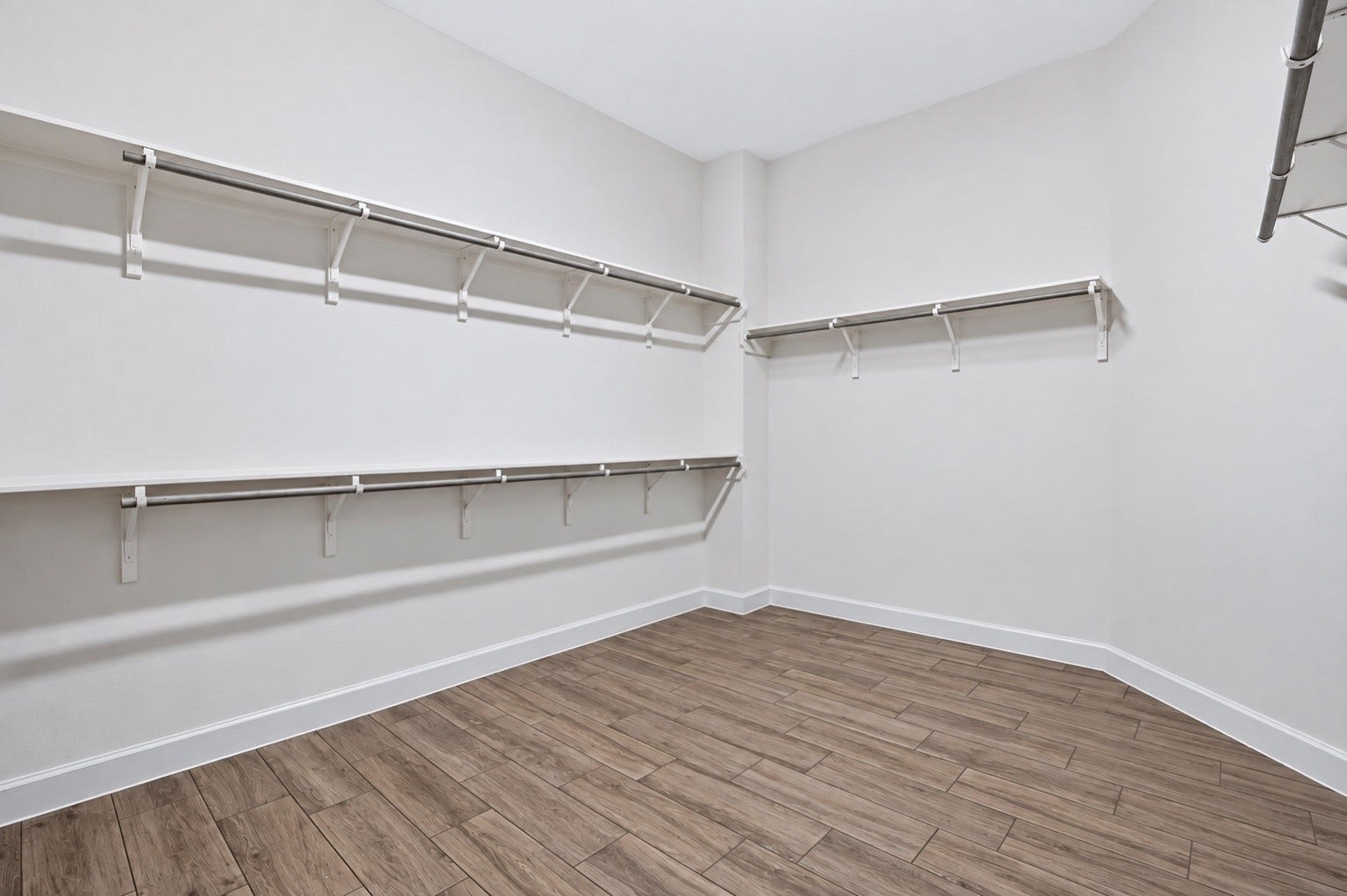 1515 Shining Willow Court, Richmond, TX 77406 Large walk-in primary closet with plenty of shelving and hanging space for storage and organization.