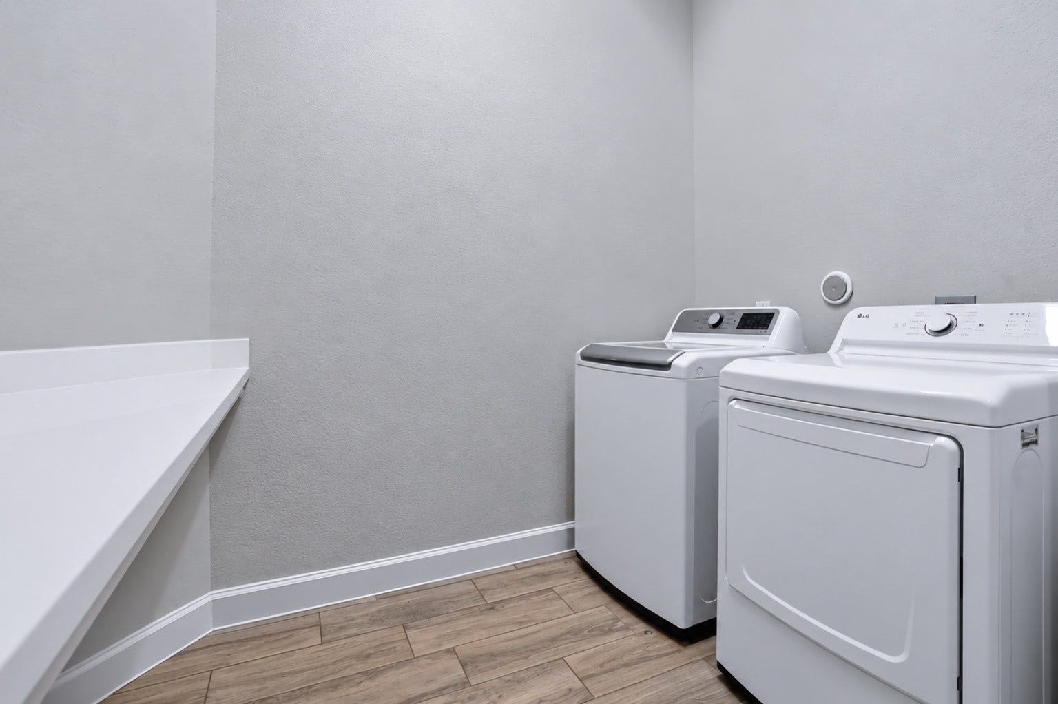 1515 Shining Willow Court, Richmond, TX 77406 Dedicated laundry room with countertop space for folding and additional storage.