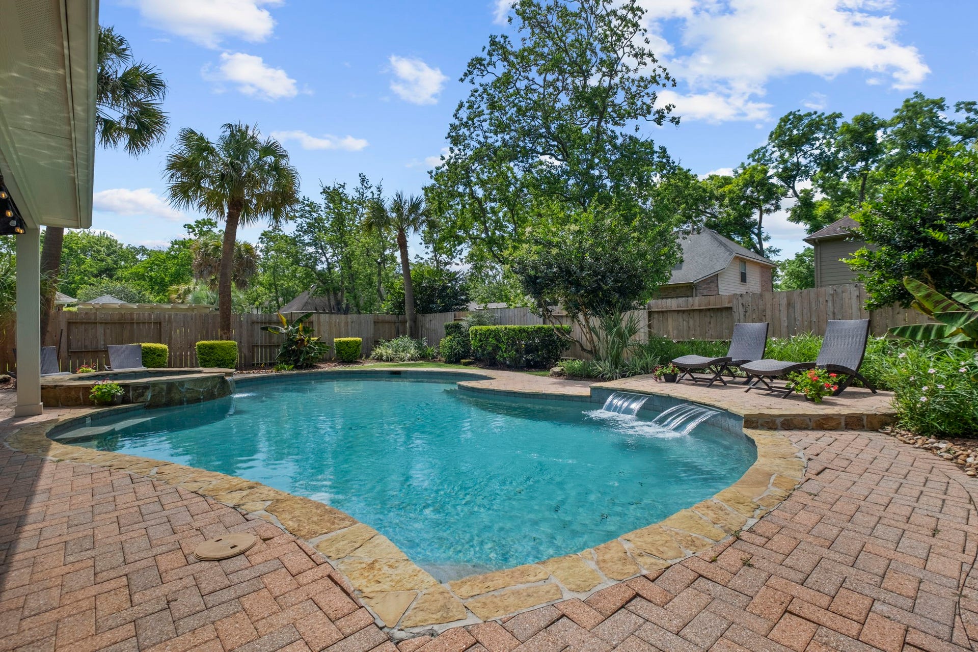 9614 Pennington Lane, Missouri City, TX 77459 Backyard oasis combines pool, spa, and outdoor living in one exceptional setting.