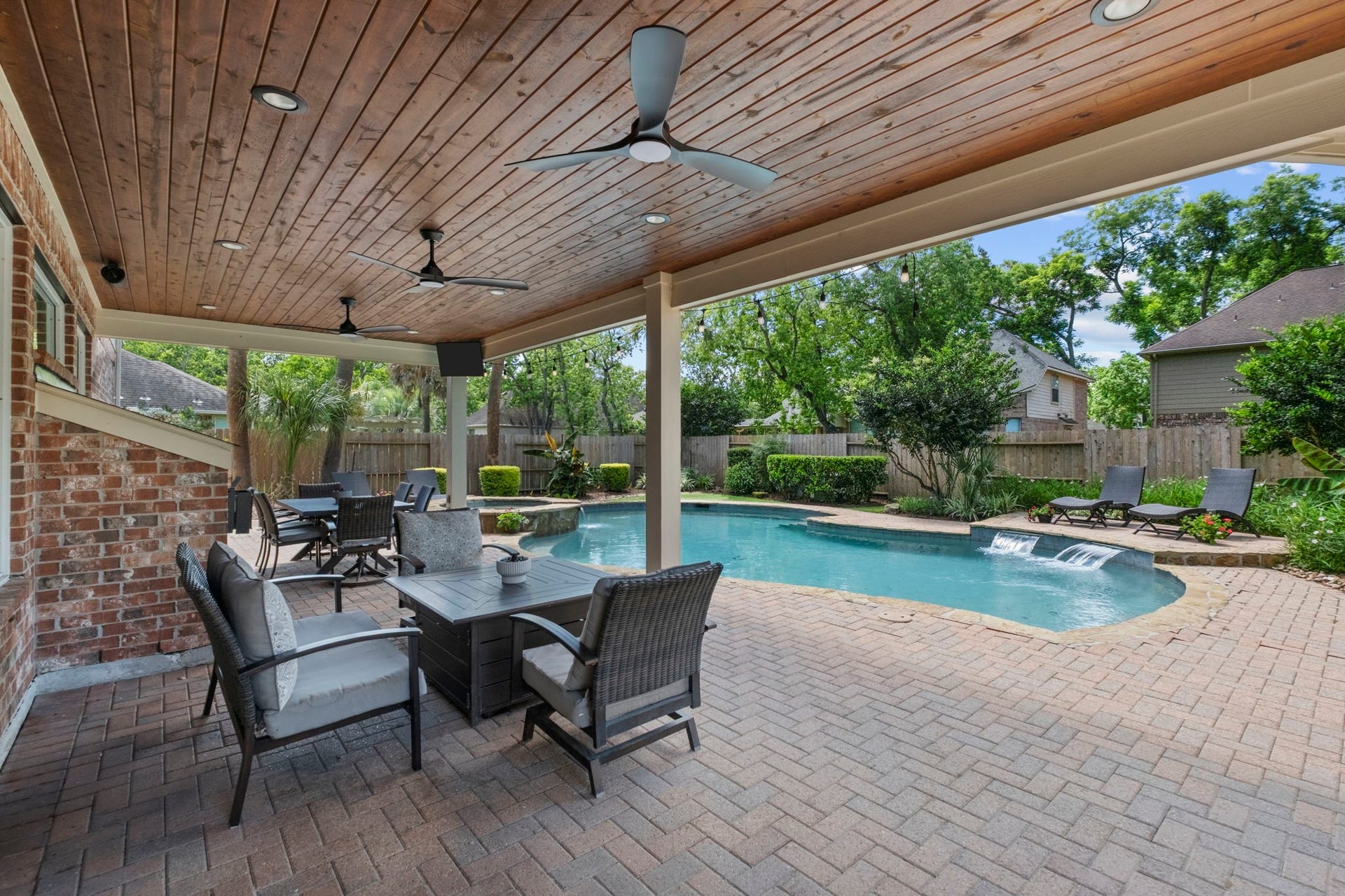 9614 Pennington Lane, Missouri City, TX 77459 Extended covered patio includes three ceiling fans for year round comfort.
