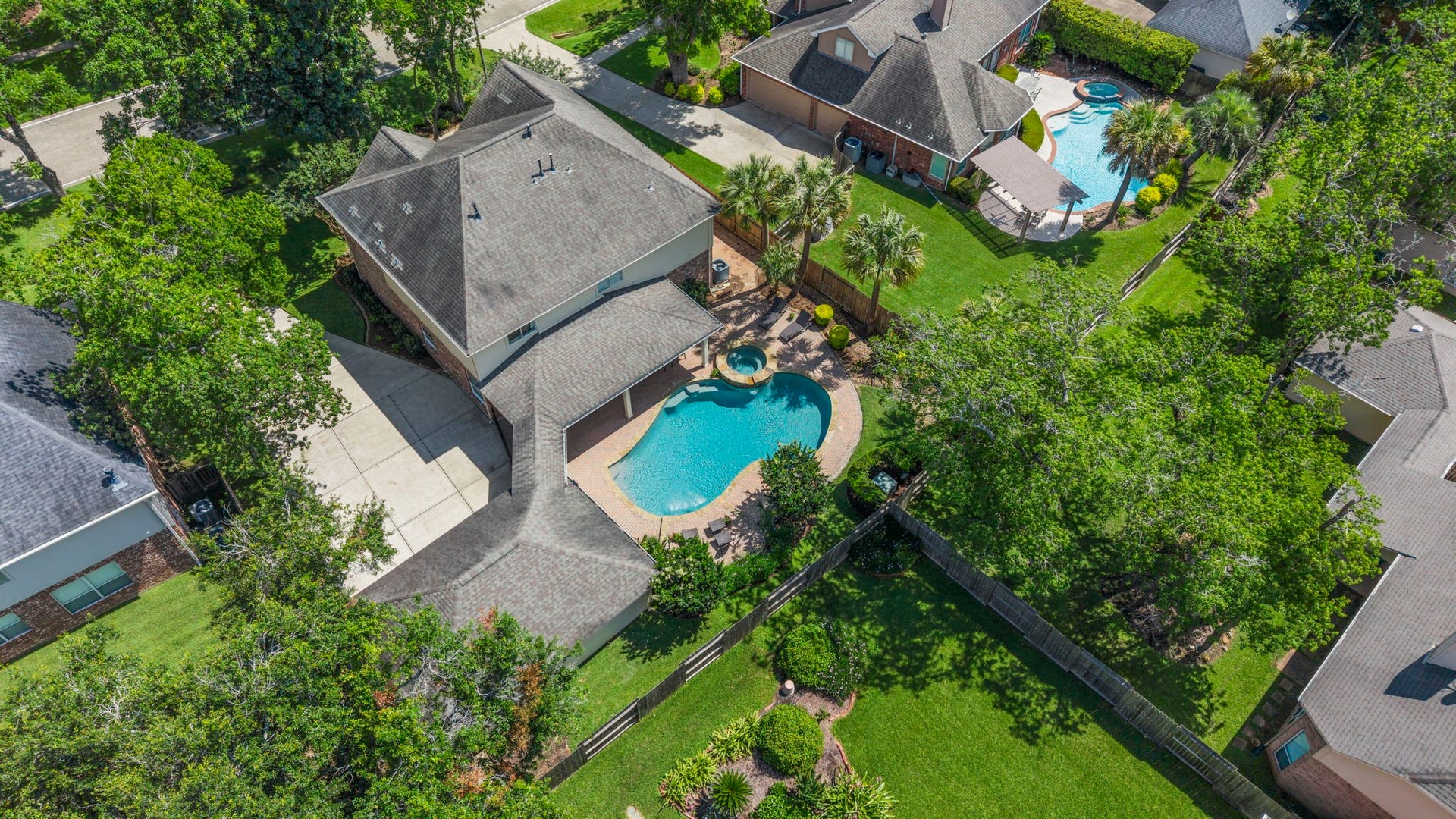 9614 Pennington Lane, Missouri City, TX 77459 Mature trees provide shade and privacy throughout the backyard.