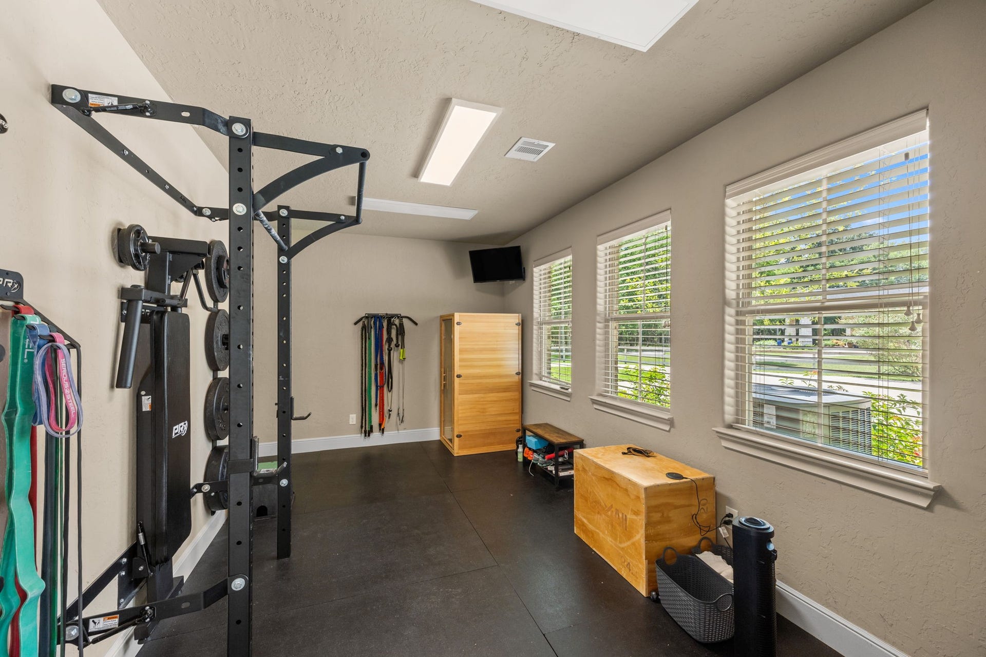 2734 Forest View, Richmond, TX 77406 Workout space is entered through the garage or from a back exterior door. Convenient at home workout with a quick swim or run before or after.