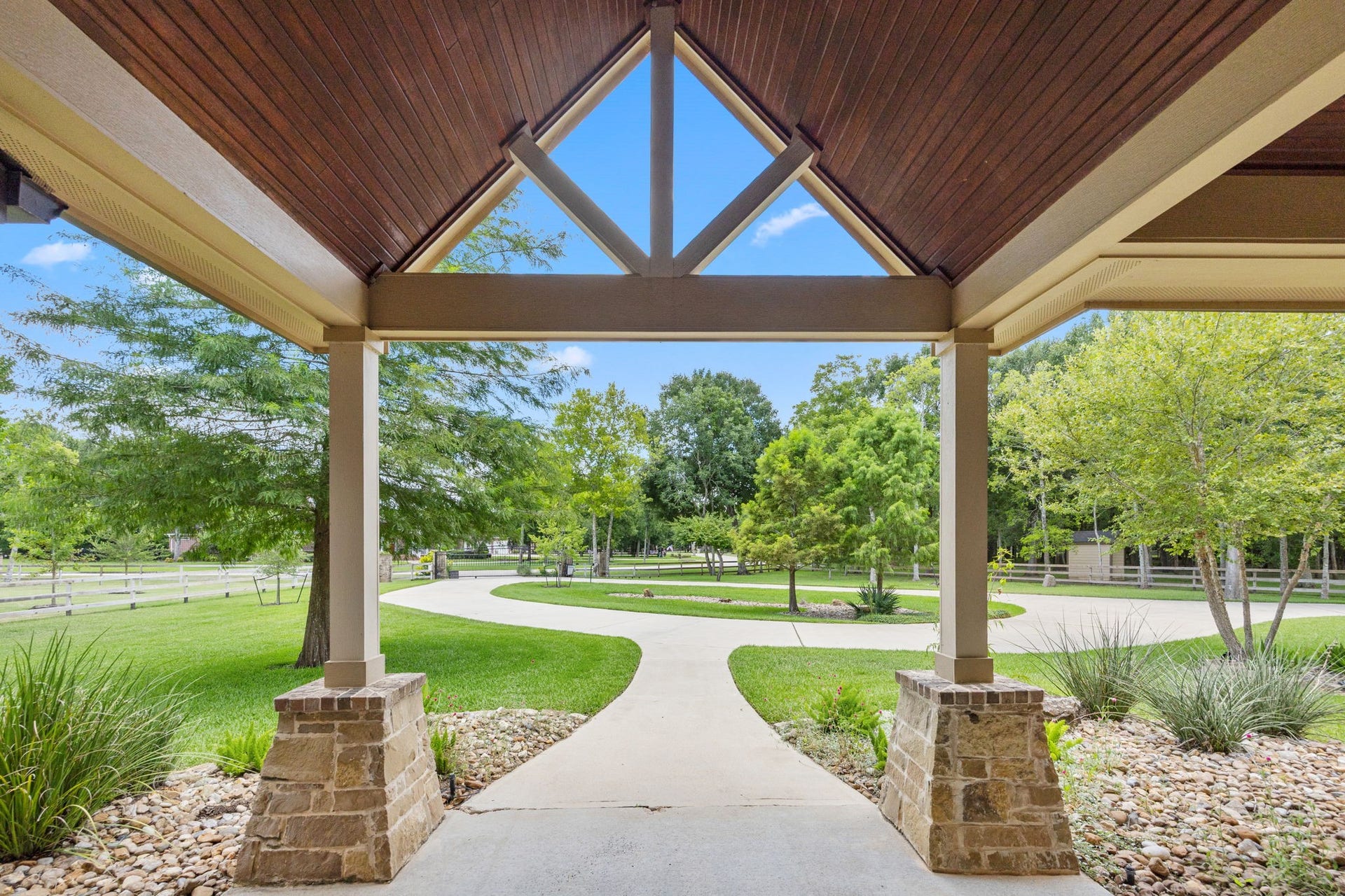 2734 Forest View, Richmond, TX 77406 Looking out of the front porch area to the front yard and additional private automated gate specifically for this property.