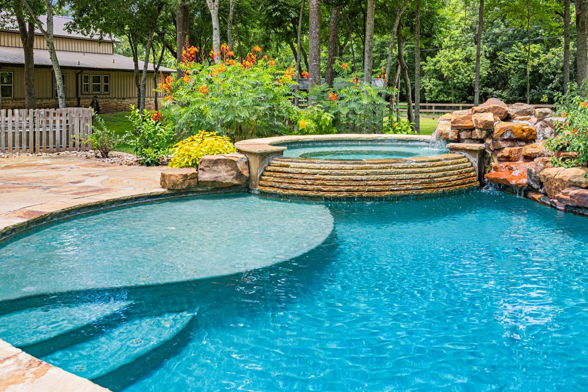 2734 Forest View, Richmond, TX 77406 Tranquil waters, beach landing, large spa and tropical plants. Did I mention no rear neighbors except for trees?