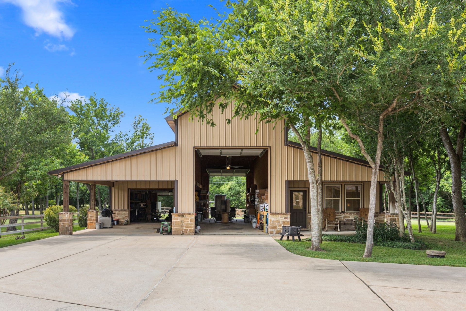 2734 Forest View, Richmond, TX 77406 Center is the RV area, 12'x14' doors each end, 55' deep. Another carport and garage/workshop area left with a back garage door. To the right is the 1,080 SF quarters with a front porch.