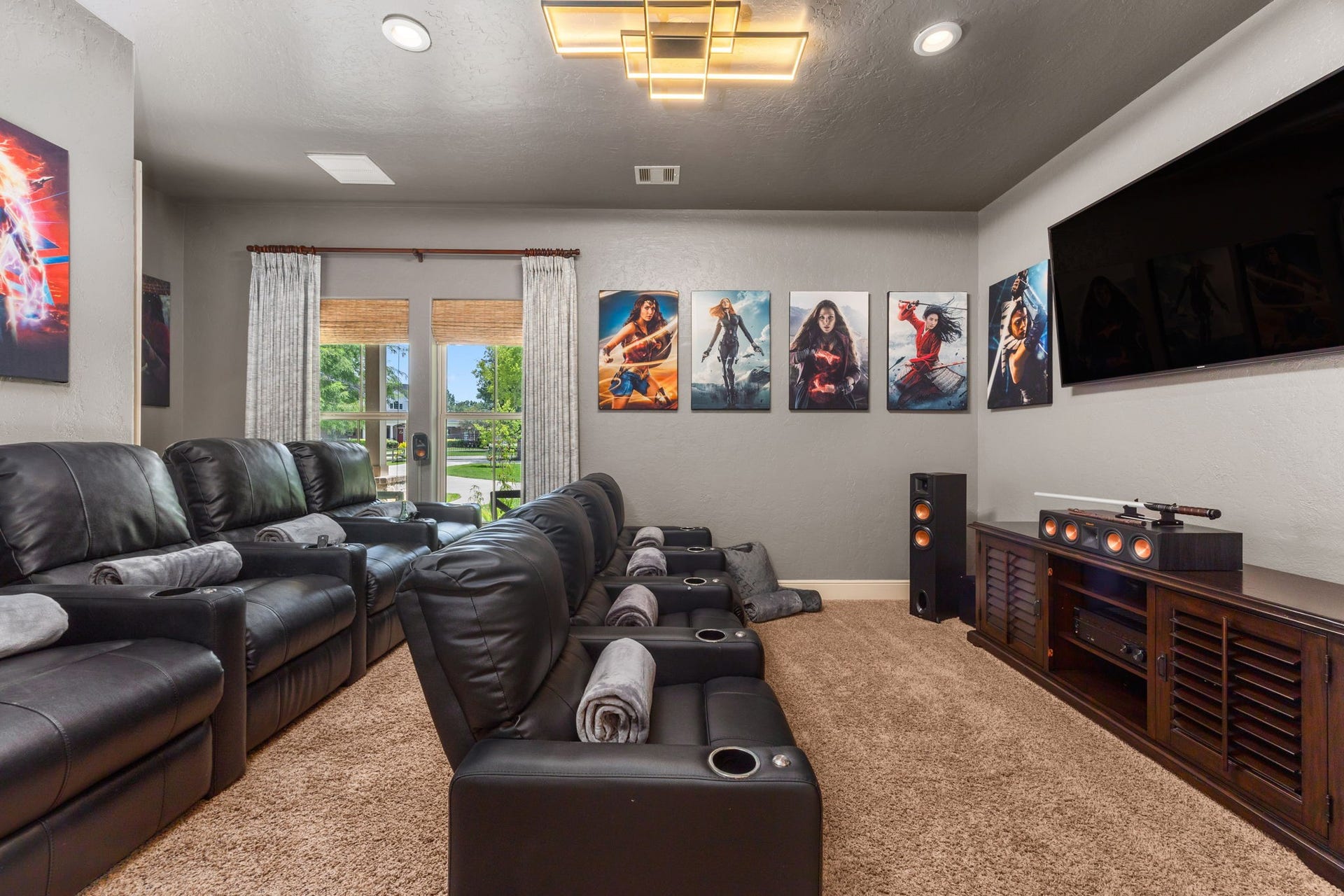2734 Forest View, Richmond, TX 77406 Media room. Enjoy movies, favorite shows and sports event in comfort and style. Pictures on wall are remote controlled backlit with multiple colors.