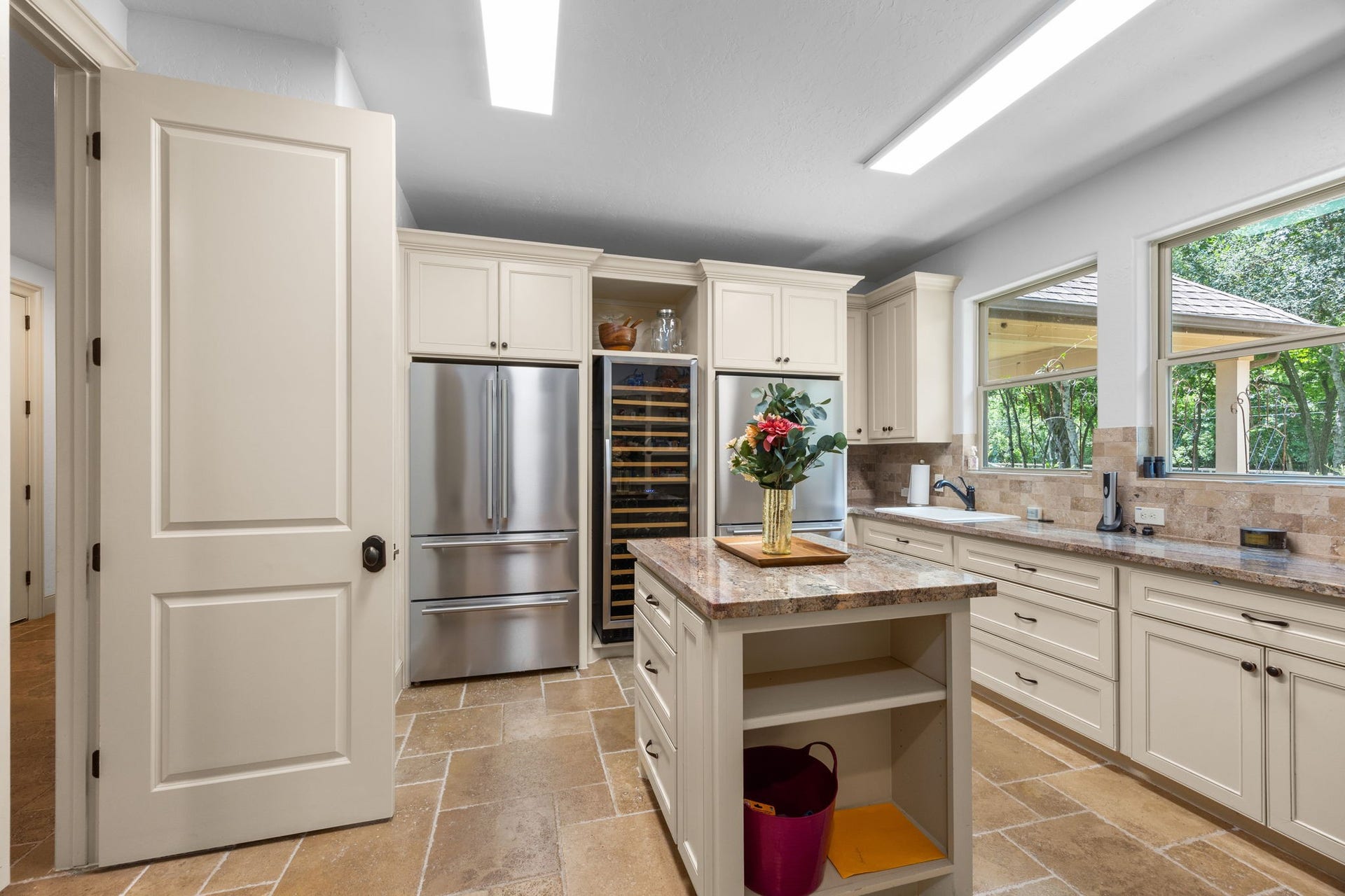 2734 Forest View, Richmond, TX 77406 Butler's pantry has double fridge/freezers, a large wine chiller, additional sink/storage and shelving.